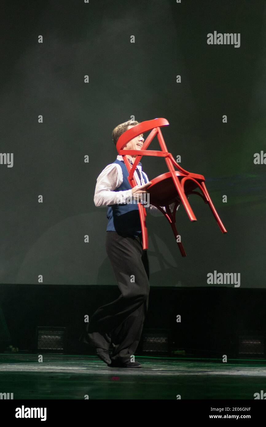 Actor dancer young man performs in the theater on stage in a retro ...