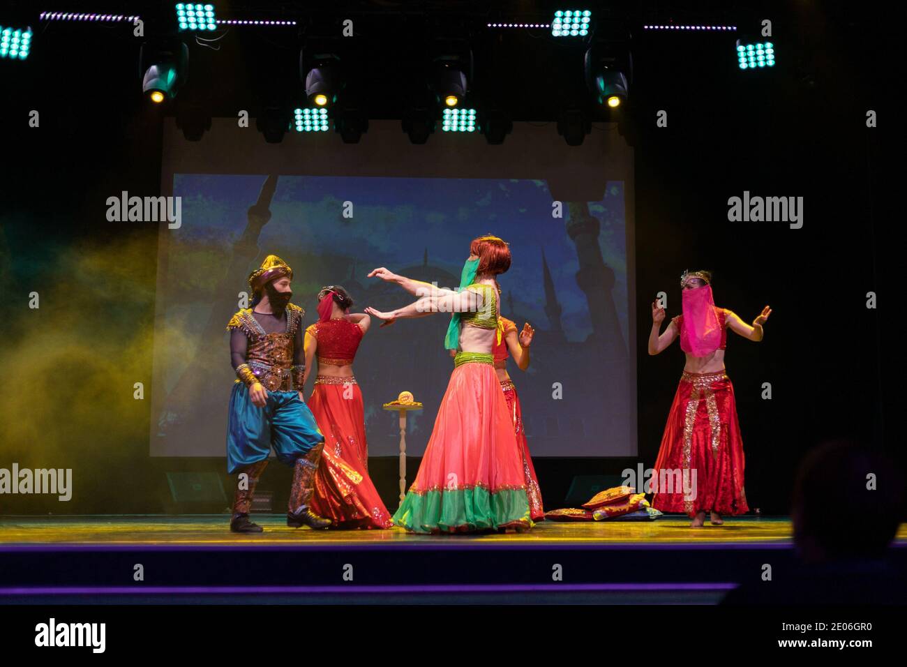 Dancers actors in Oriental Bellydance costumes perform in theater on ...