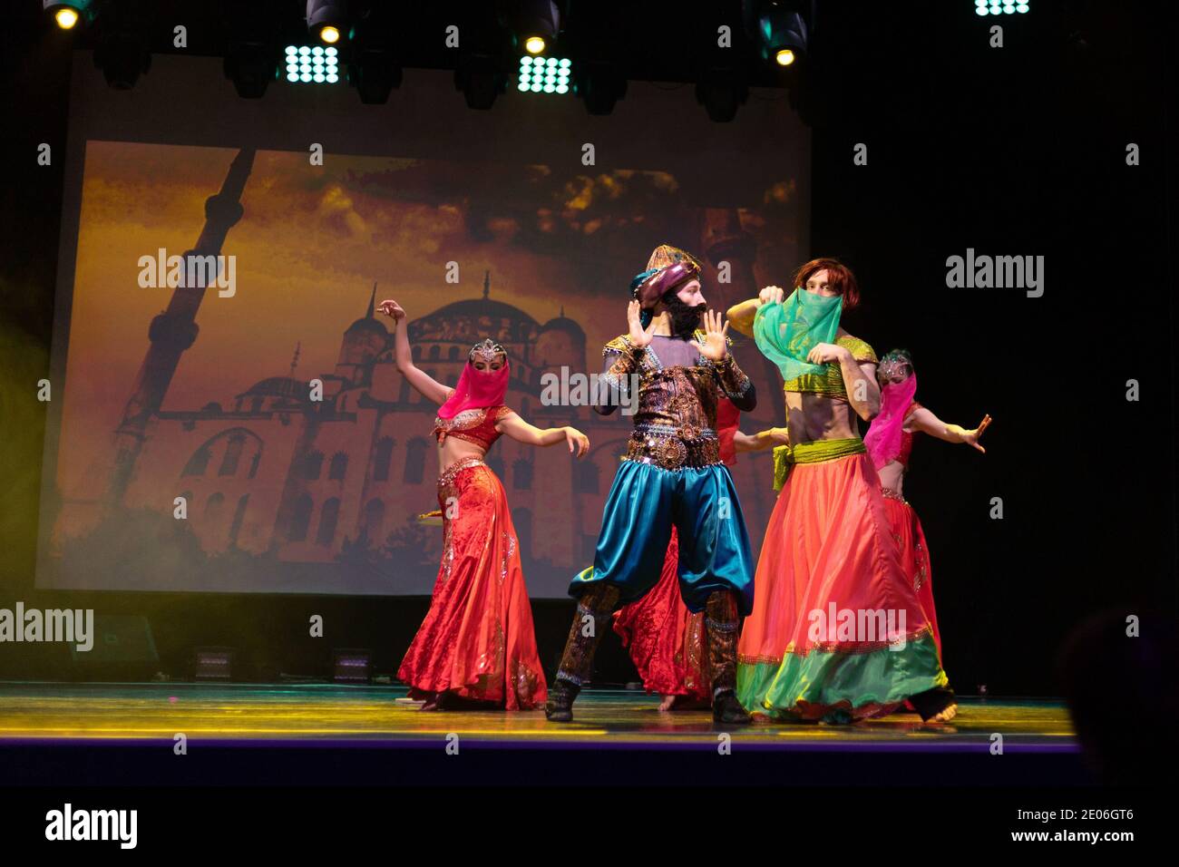 Dancers actors in Oriental Bellydance costumes perform in theater on ...