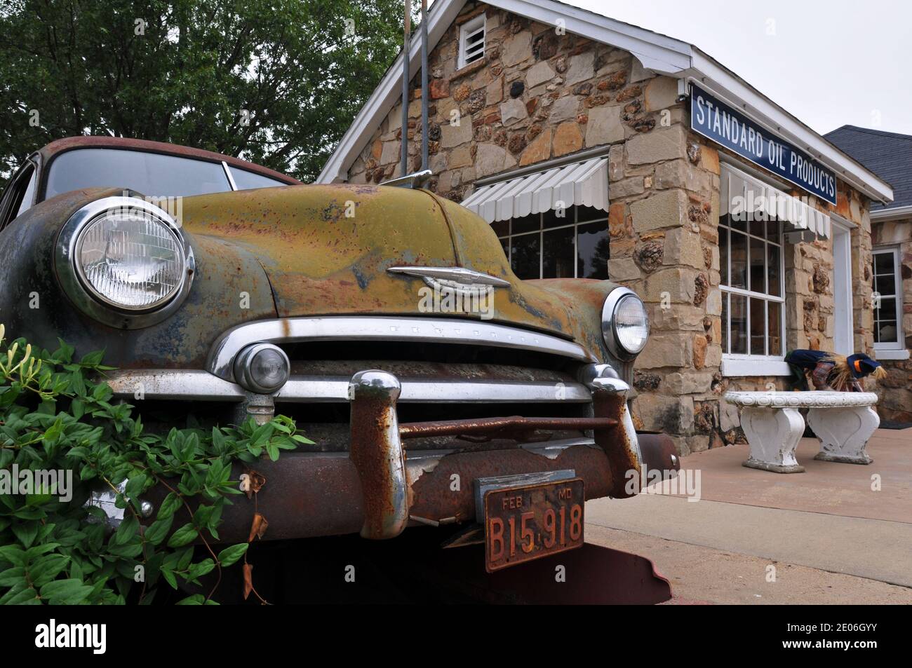 An old Chevrolet sits near the former service station at the Wagon