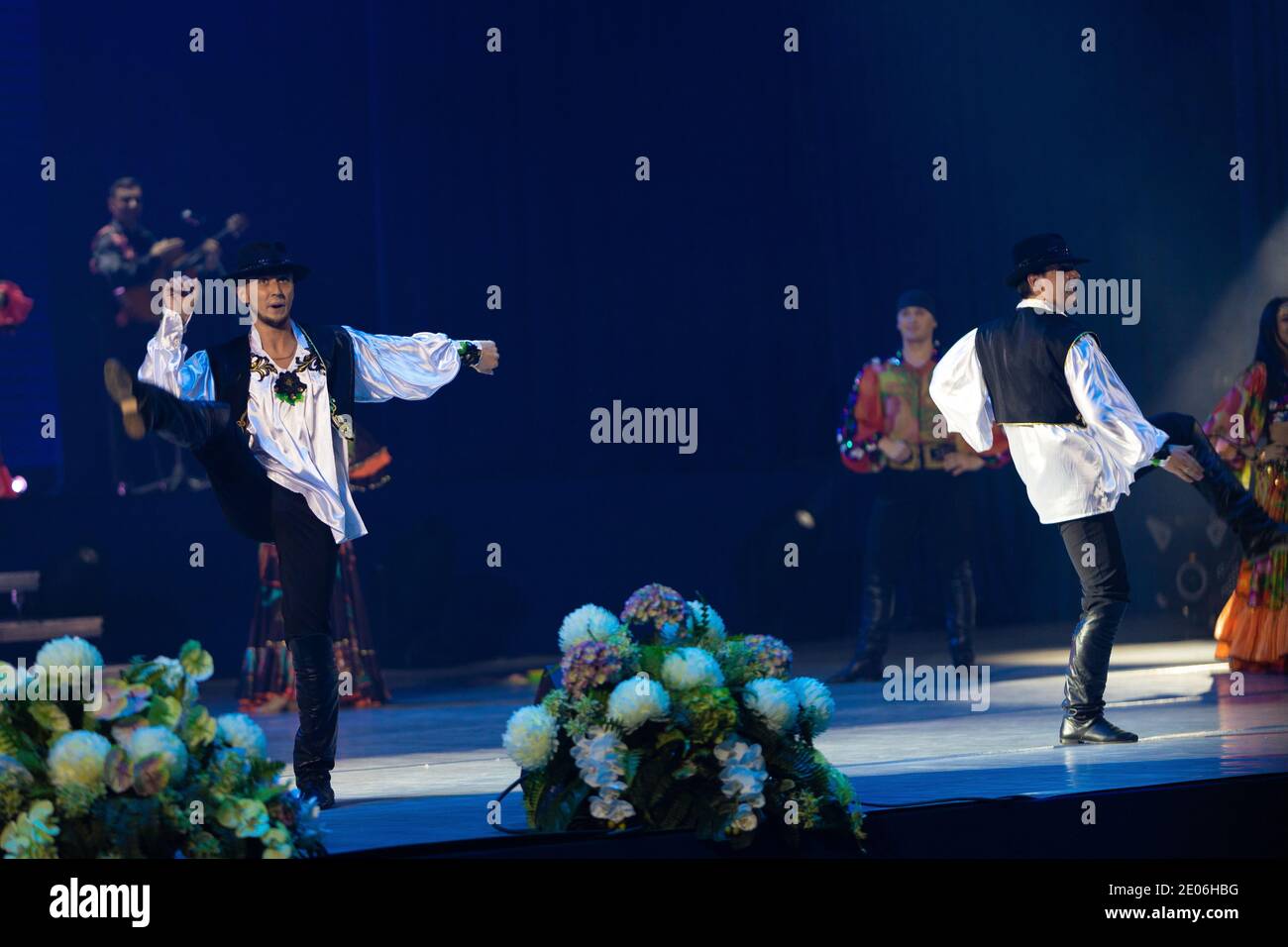 A team of musicians, singers and dancers in gypsy costumes singing and