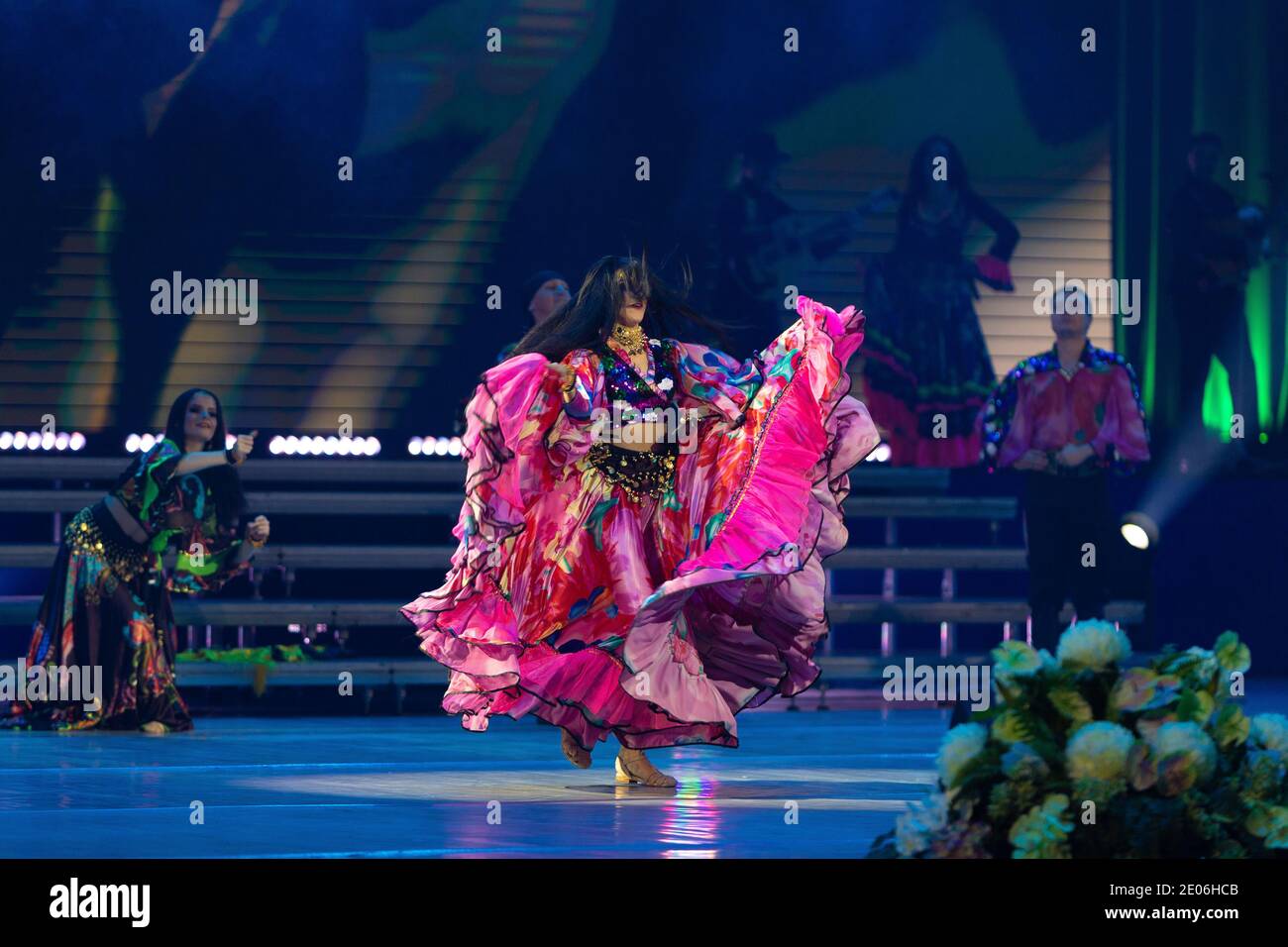 A team of musicians, singers and dancers in gypsy costumes singing and