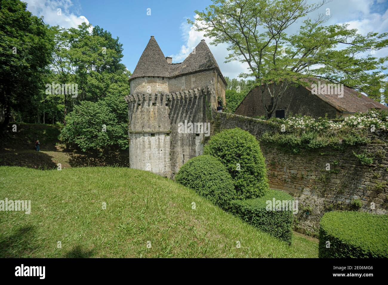 Fortified farmhouse in the Perigord region, France - This old fortified farmhouse is surrounded by ramparts with a corner tower. Stock Photo