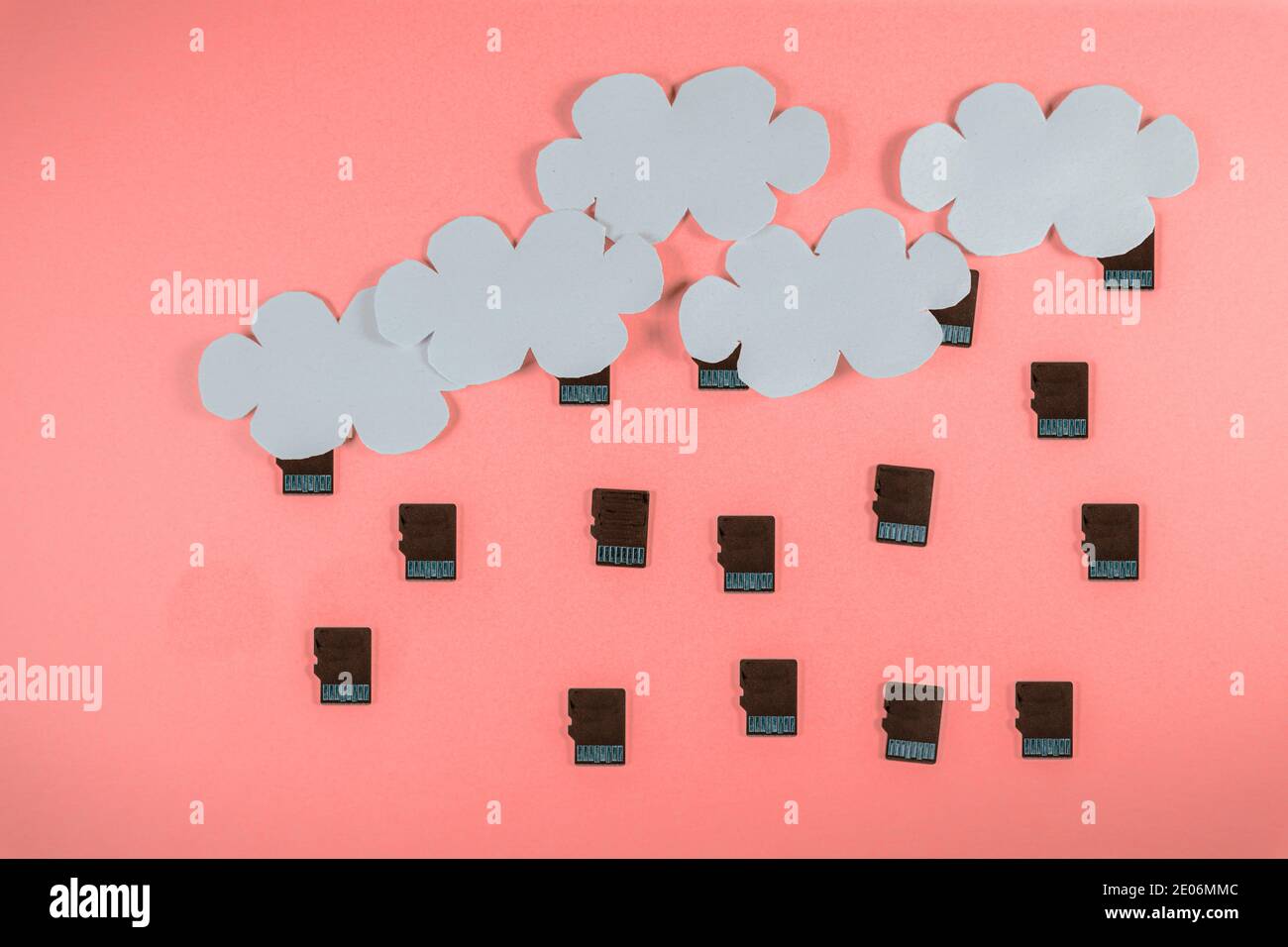 Cloud computing concept, paper clouds with micro SD cards as raindrops Stock Photo