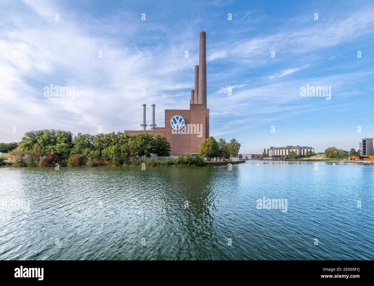 The iconic Volkswagen power station for their huge factory in Wolfsburg on the Mittellandkanal, kanal. Opposite is the VW Autostadt - car city. Stock Photo