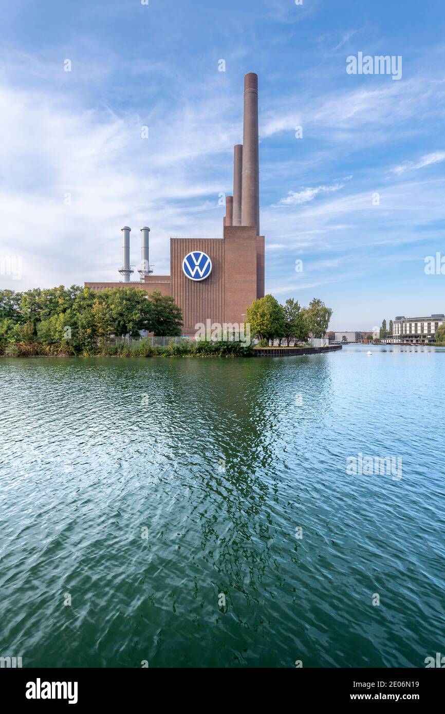 The iconic Volkswagen power station for their huge factory in Wolfsburg on the Mittellandkanal, kanal. Opposite is the VW Autostadt - car city. Stock Photo