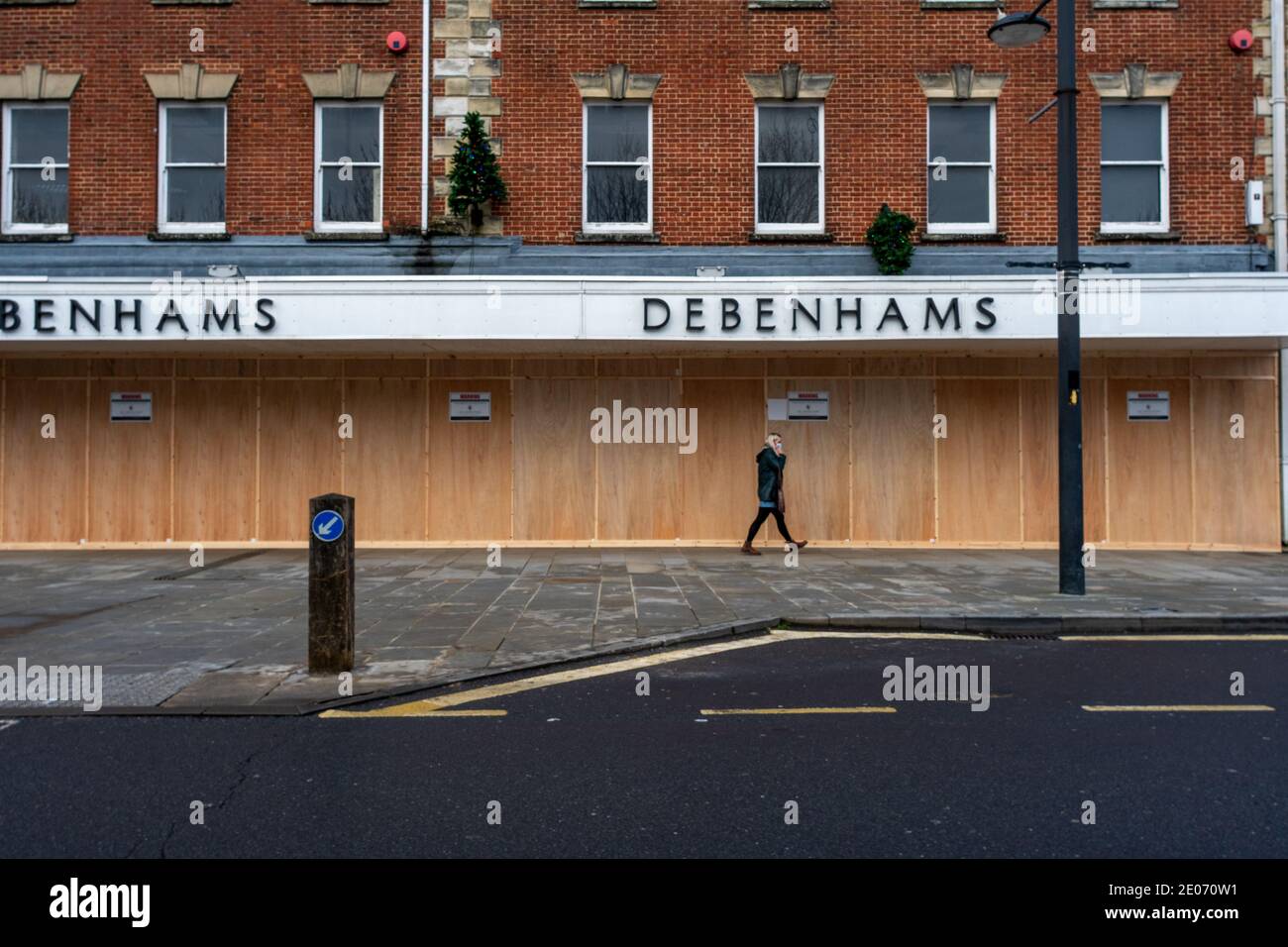 Closed and boarded up Debenhams store. The high street department store business went into administration in December 2020. Stock Photo