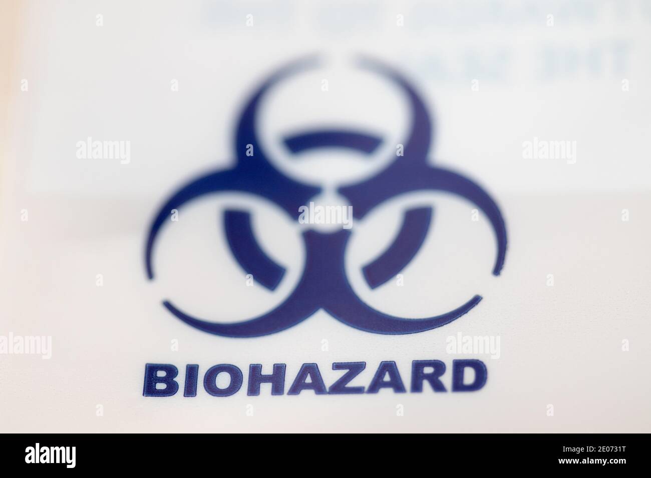 A blue biohazard symbol on a plastic bag Stock Photo