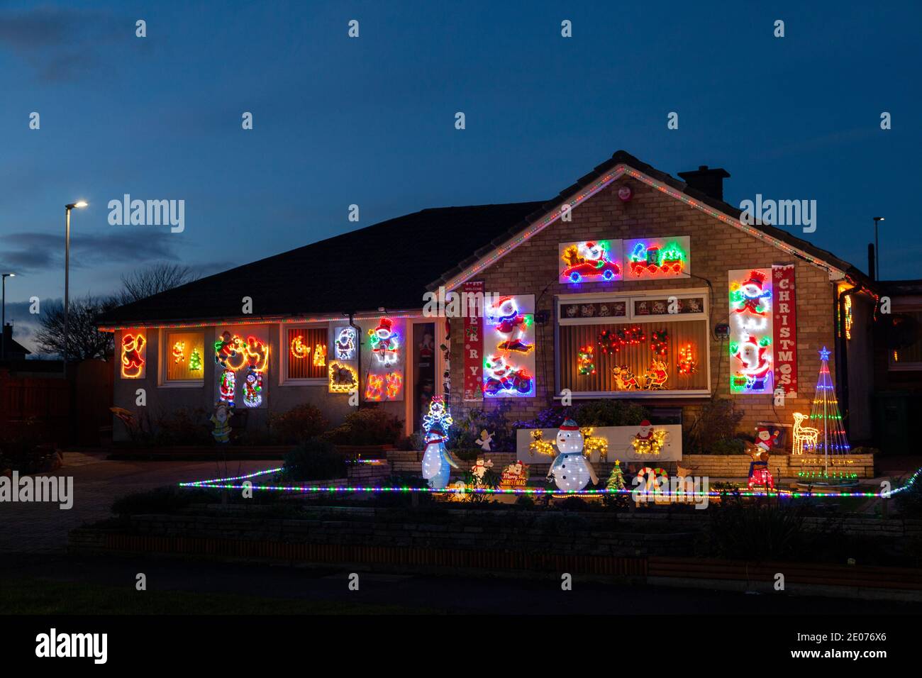 House in Kirkcaldy Fife with abundant exterior Christmas lights Stock