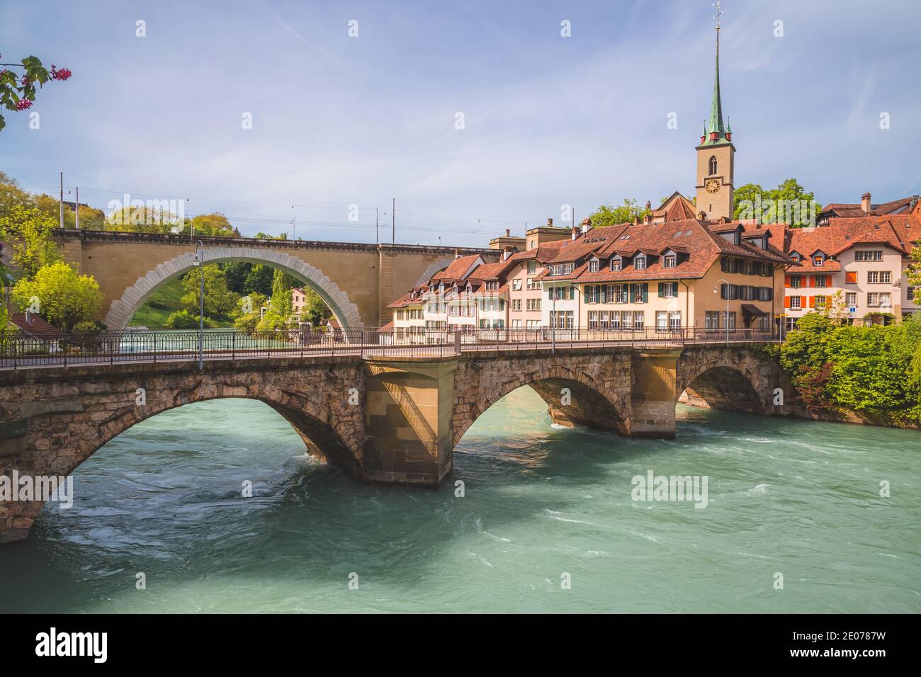 A view over the River Aare in Bern, Switzerland and the historic 14th century Nydeggkirche. Stock Photo