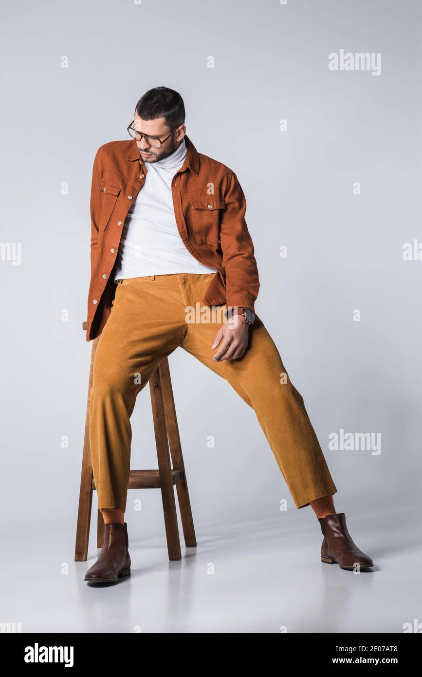 Man sitting chair studio shot hi-res stock photography and images - Alamy