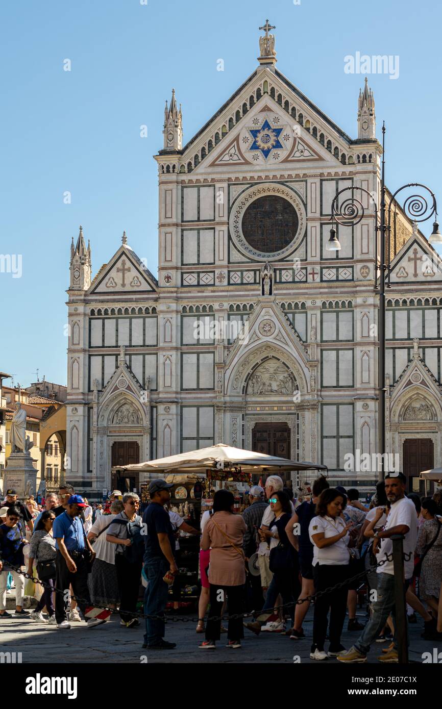 Tourists in Piazza di Santa Croce with The Basilica di Santa Croce in the background, Florence, Italy Stock Photo