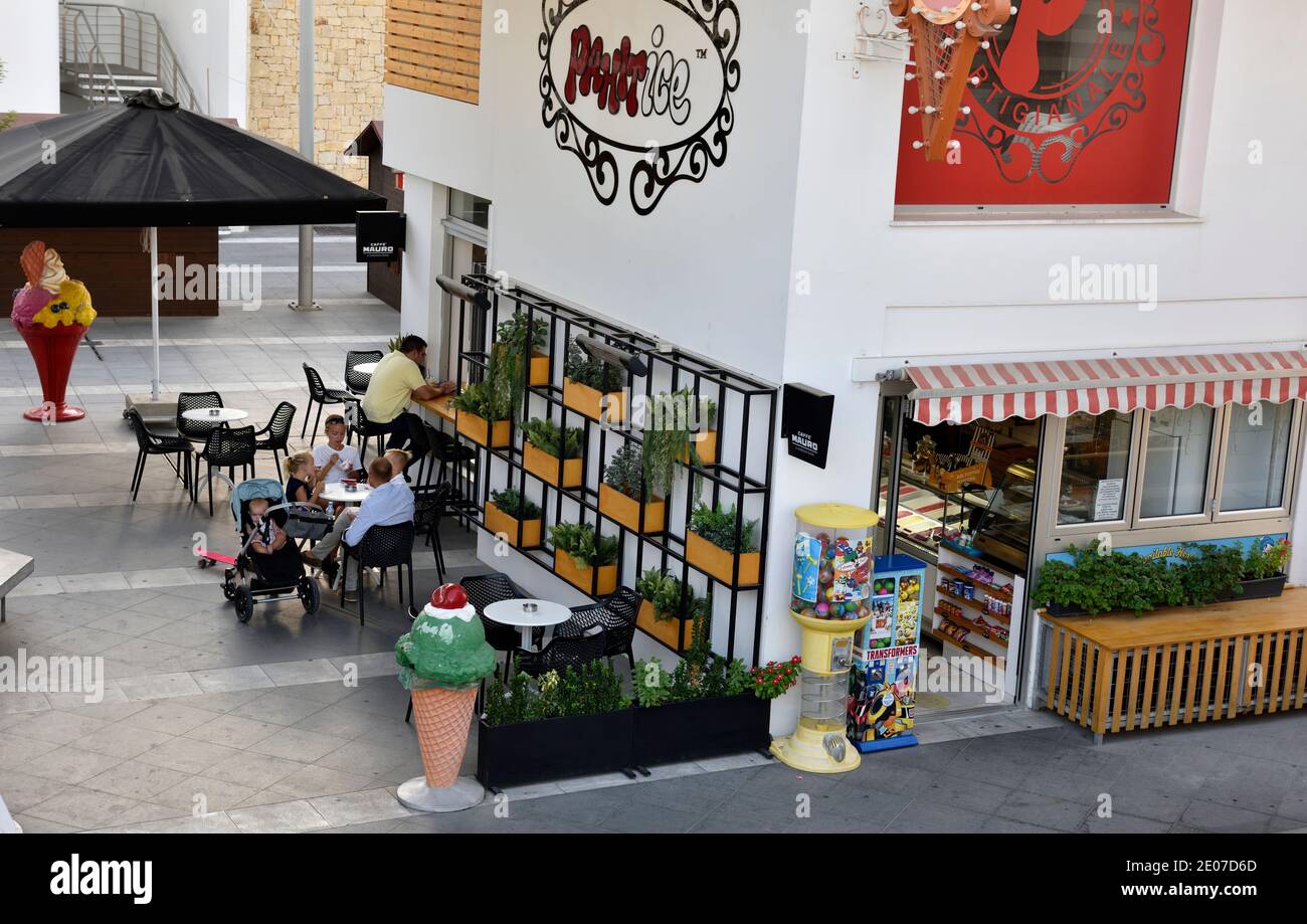 Looking from above ice cream shop (Galactica Gelato) and outdoor dinning, by Plac Syntagma, Limassol Old Port, Cyprus Stock Photo