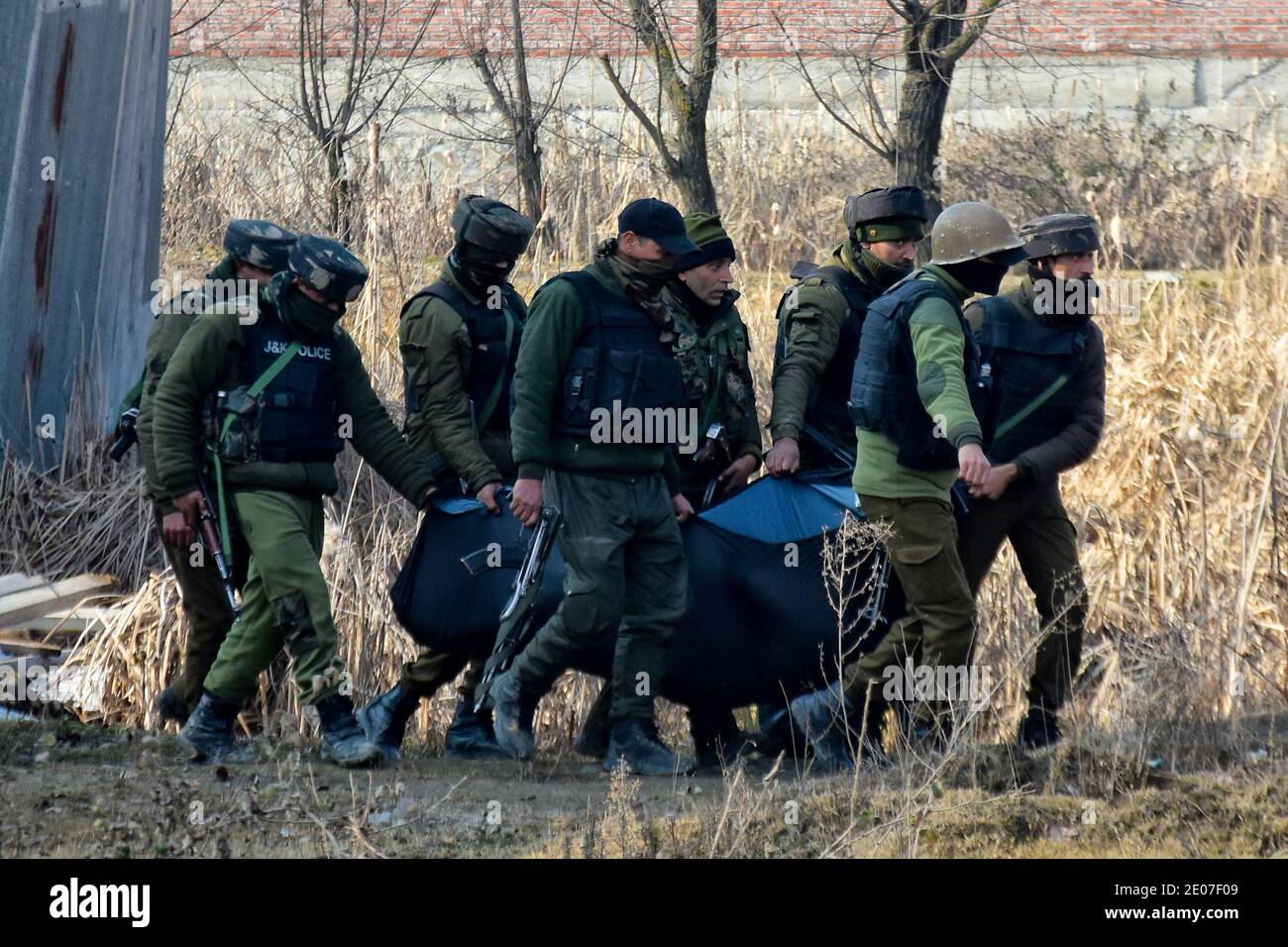 December 30, 2020: Indian forces recover the dead bodies believed to be of militants from an encounter site in HMT area of Srinagar, Indian Administered Kashmir on 30 December2020. Three millitants were killed in an overnight encounter with Indian Forces. Credit: Muzamil Mattoo/IMAGESLIVE/ZUMA Wire/Alamy Live News Stock Photo