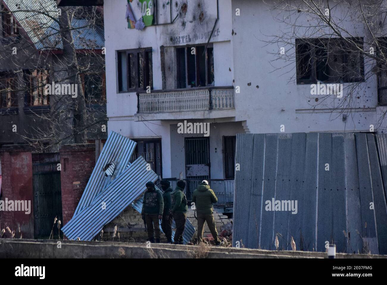 December 30, 2020: Indian forces remain outside the encounter site during an encounter with Millitants in HMT area of Srinagar, Indian Administered Kashmir on 30 December2020. Three millitants were killed in an overnight encounter with Indian Forces. Credit: Muzamil Mattoo/IMAGESLIVE/ZUMA Wire/Alamy Live News Stock Photo