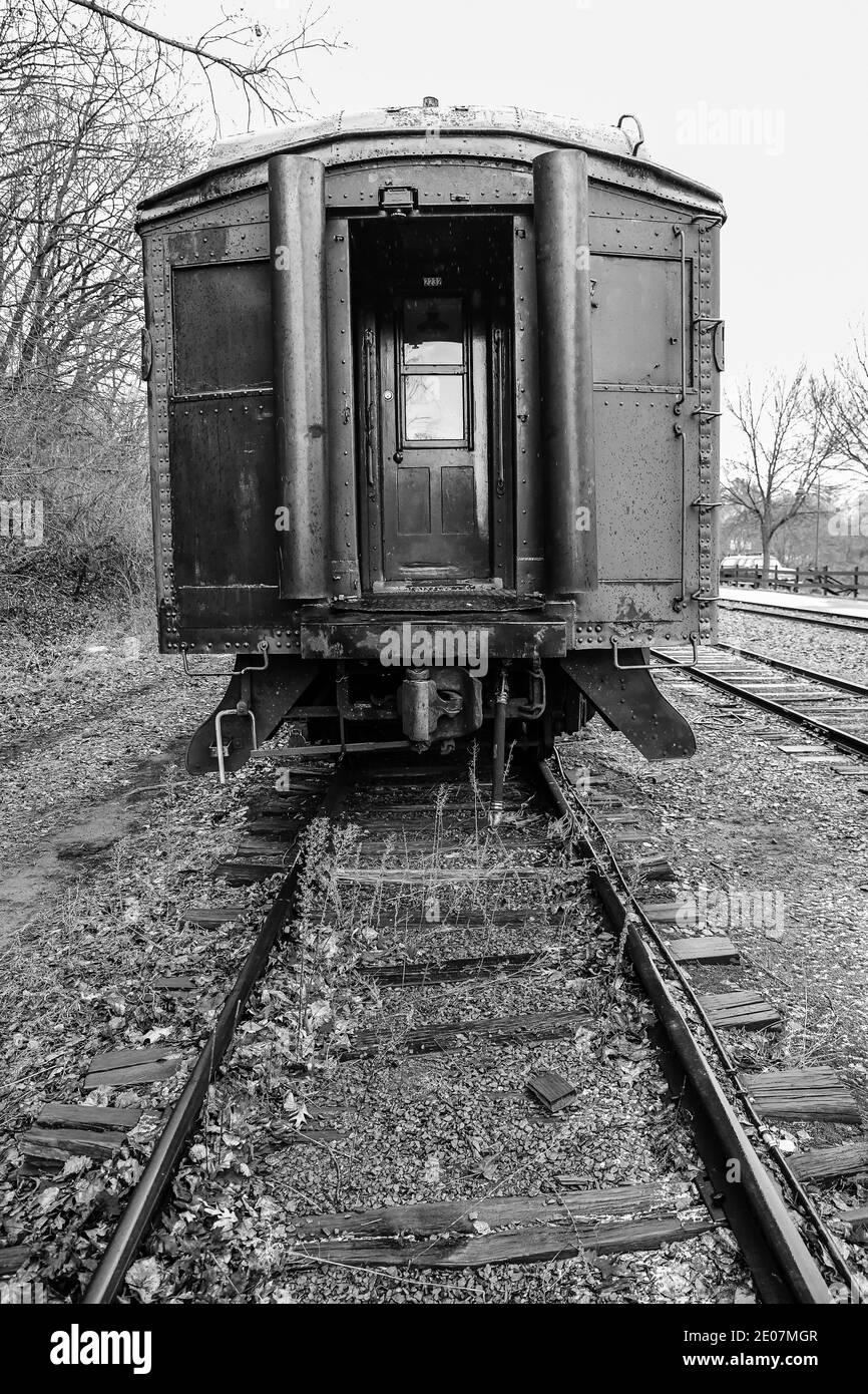 Vintage and abandoned empty railroad train car on the train tracks