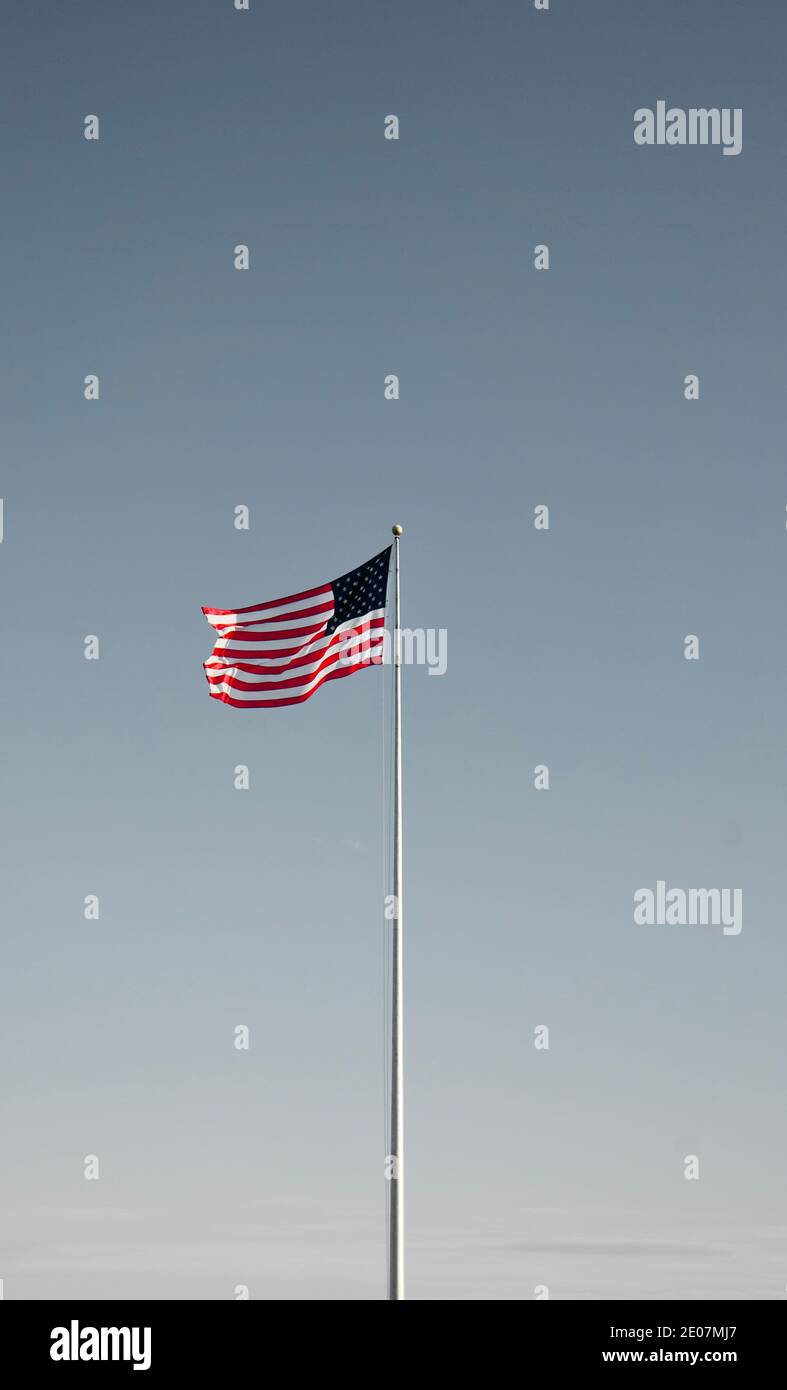 Flag of the United States, aka American flag or the U.S. flag- the national flag of America blowing in the wind. The Star-Spangled Banner/Old Glory. Stock Photo