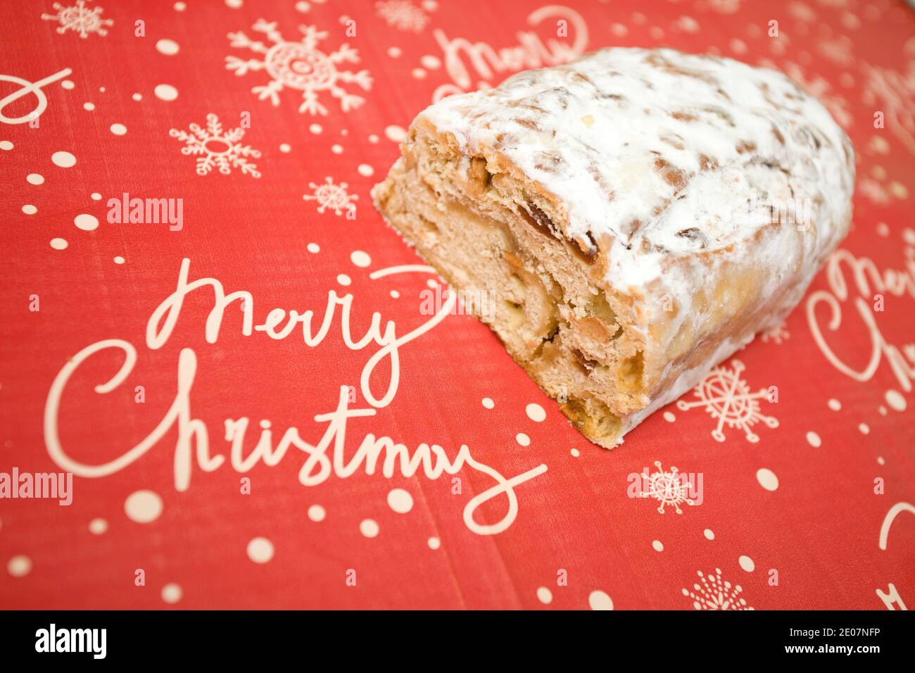 Stollen on Merry Christmas red and white background Stock Photo