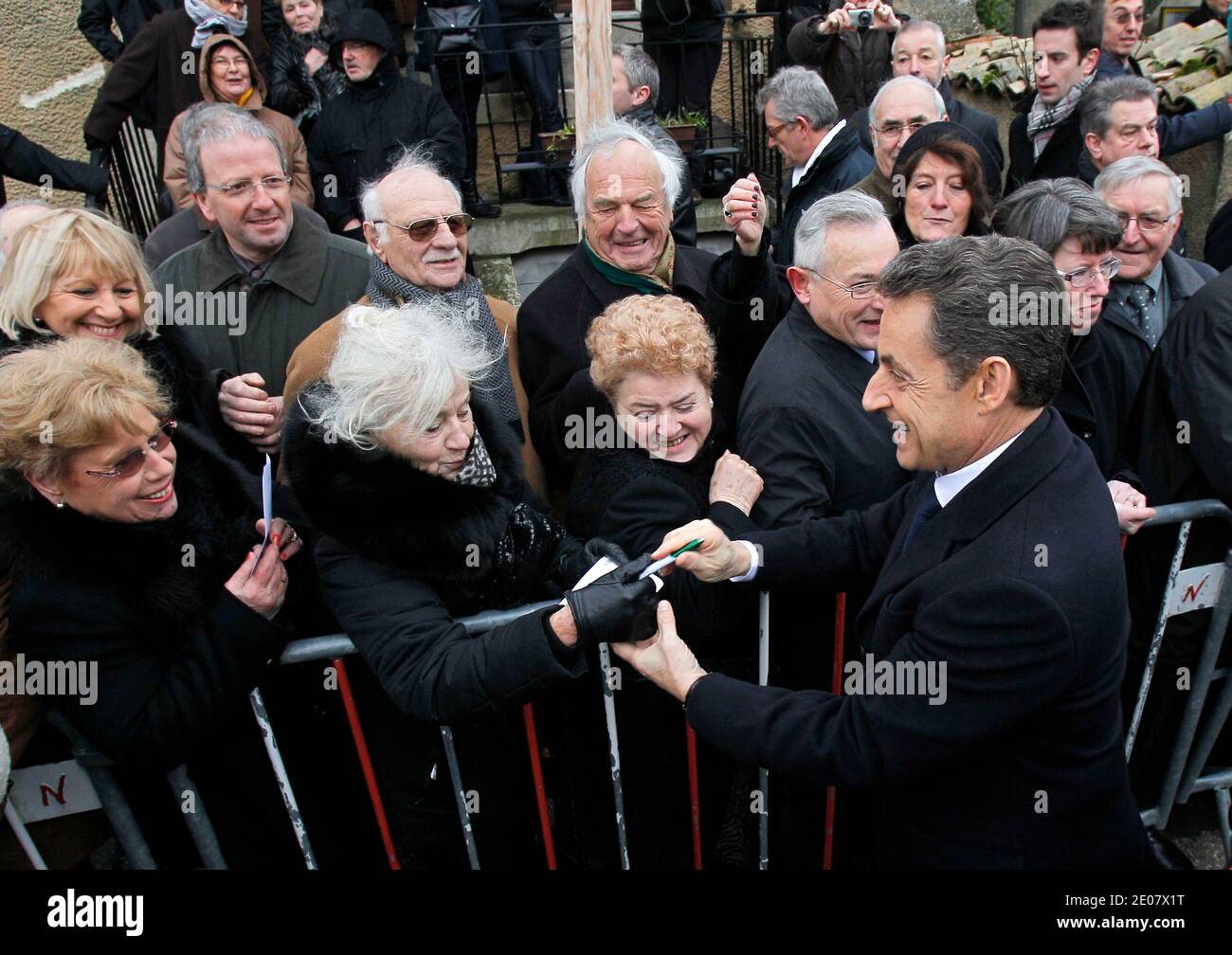 French President Nicolas Sarkozy, shakes hands with bystanders during celebrations of the 600th anniversary of the birth of French heroine Jeanne D'Arc in Domremy, eastern France, on January 6, 2012. Jeanne D'Arc a 15th century Catholic martyr, a teenage peasant who led the French army against the English after experiencing religious visions and was later burned at the stake, has in recent years become a symbol of the populist right. Photo by Michel Euler/Pool/ABACAPRESS.COM Stock Photo