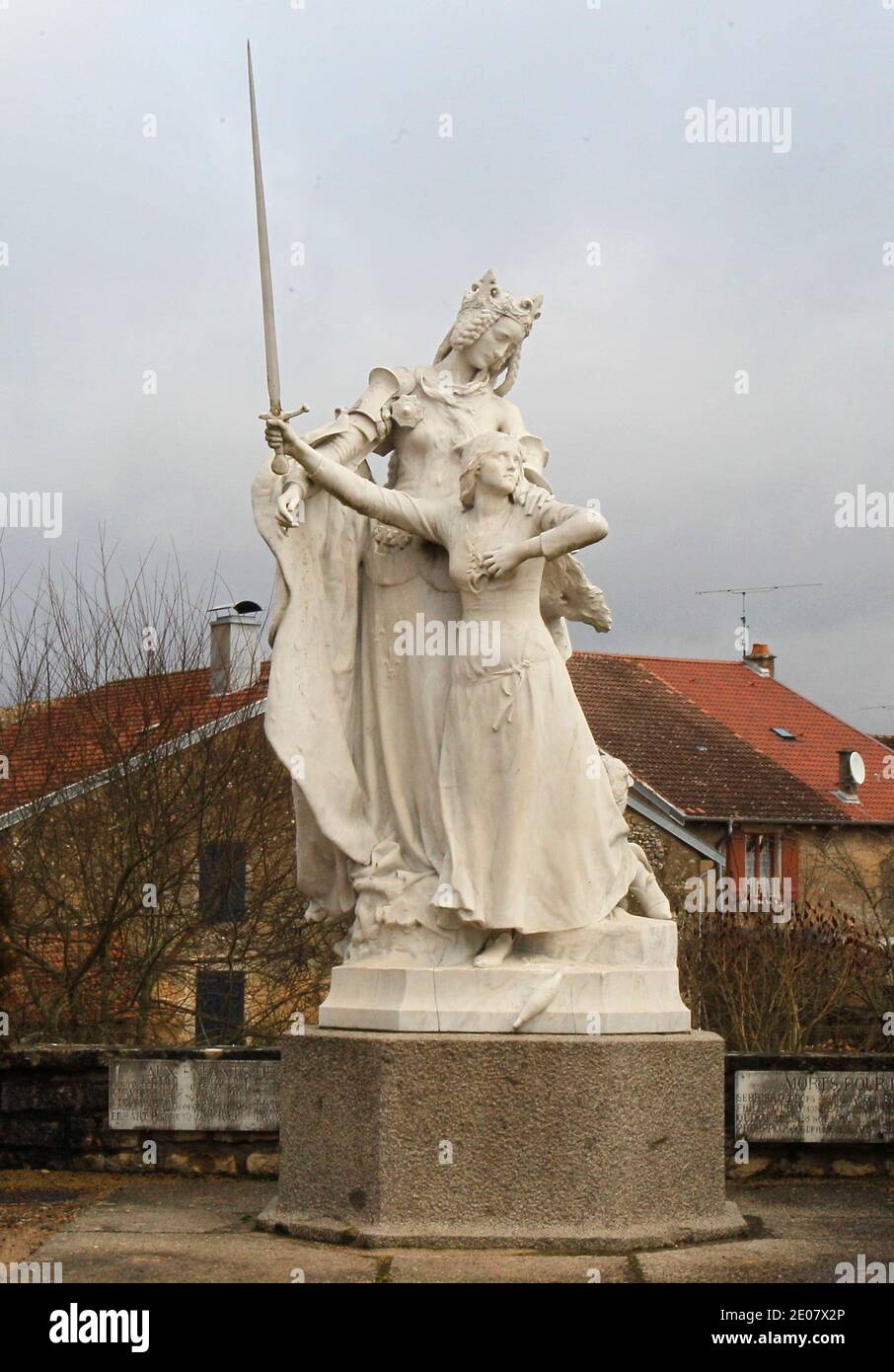 The sculpture of virgin Mary and Jeanne D'Arc with a sword is seen during celebrations of the 600th anniversary of the birth of French heroine Jeanne D'Arc at the entrance of Domremy, eastern France, on January 6, 2012. Jeanne D'Arc a 15th century Catholic martyr, a teenage peasant who led the French army against the English after experiencing religious visions and was later burned at the stake, has in recent years become a symbol of the populist right. Photo by Michel Euler/Pool/ABACAPRESS.COM Stock Photo