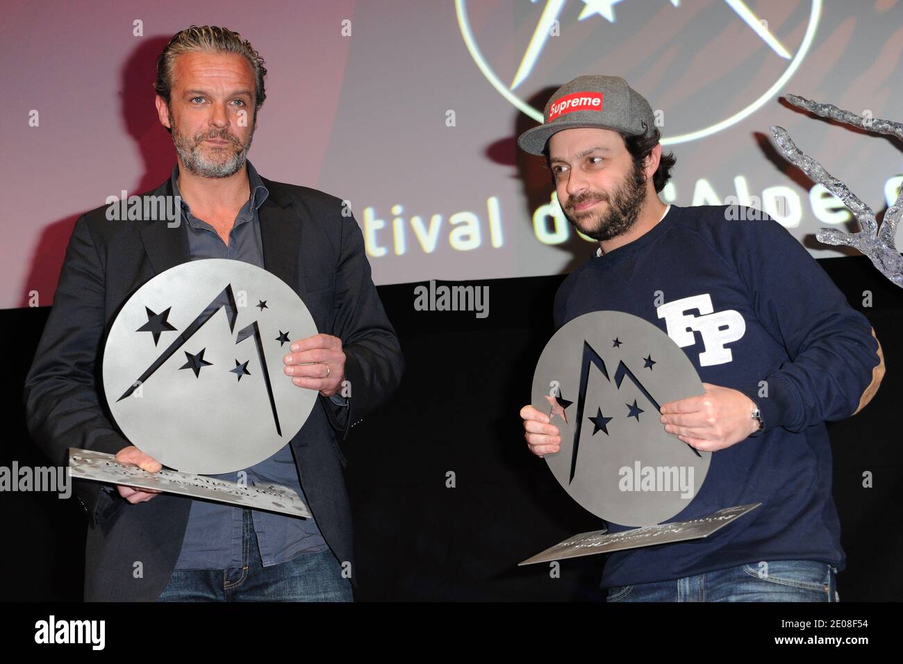 David Brecourt and Romain Levy pose after receiving the price for best  actor during closing and awards ceremony at the 15th Alpe d'Huez Comedy  Film Festival held in l'Alpe d'Huez, France on