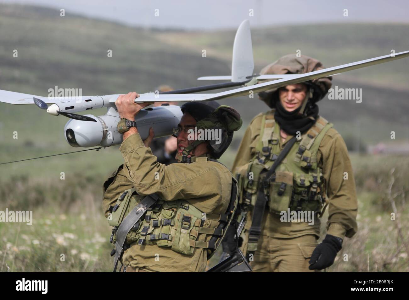 An Israeli soldier launches the Skylark drone during drill near Bat Shlomo, Israel on January 16, 2012. The Skylark can carry a camera payload of up to has an operational