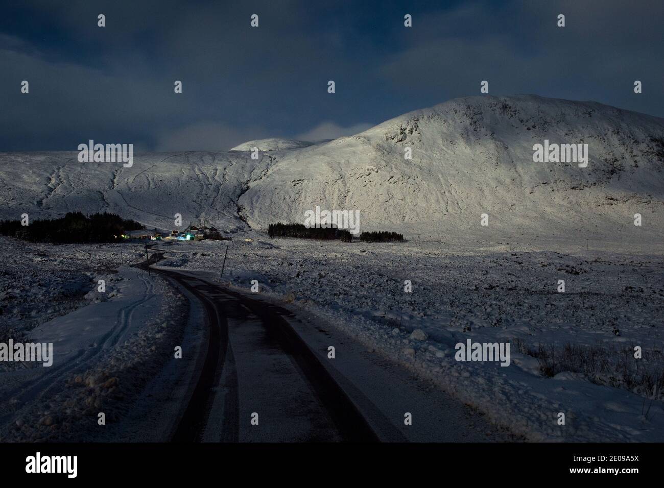 Glencoe, Scotland, UK. 30th Dec, 2020. Pictured: Glencoe ski resort illuminated under the brightness of the waning full moon. The snow reflects back the light causing a dramatic night image. Yellow snow warning in place as more snow with freezing temperatures expected again overnight. Credit: Colin Fisher/Alamy Live News Stock Photo