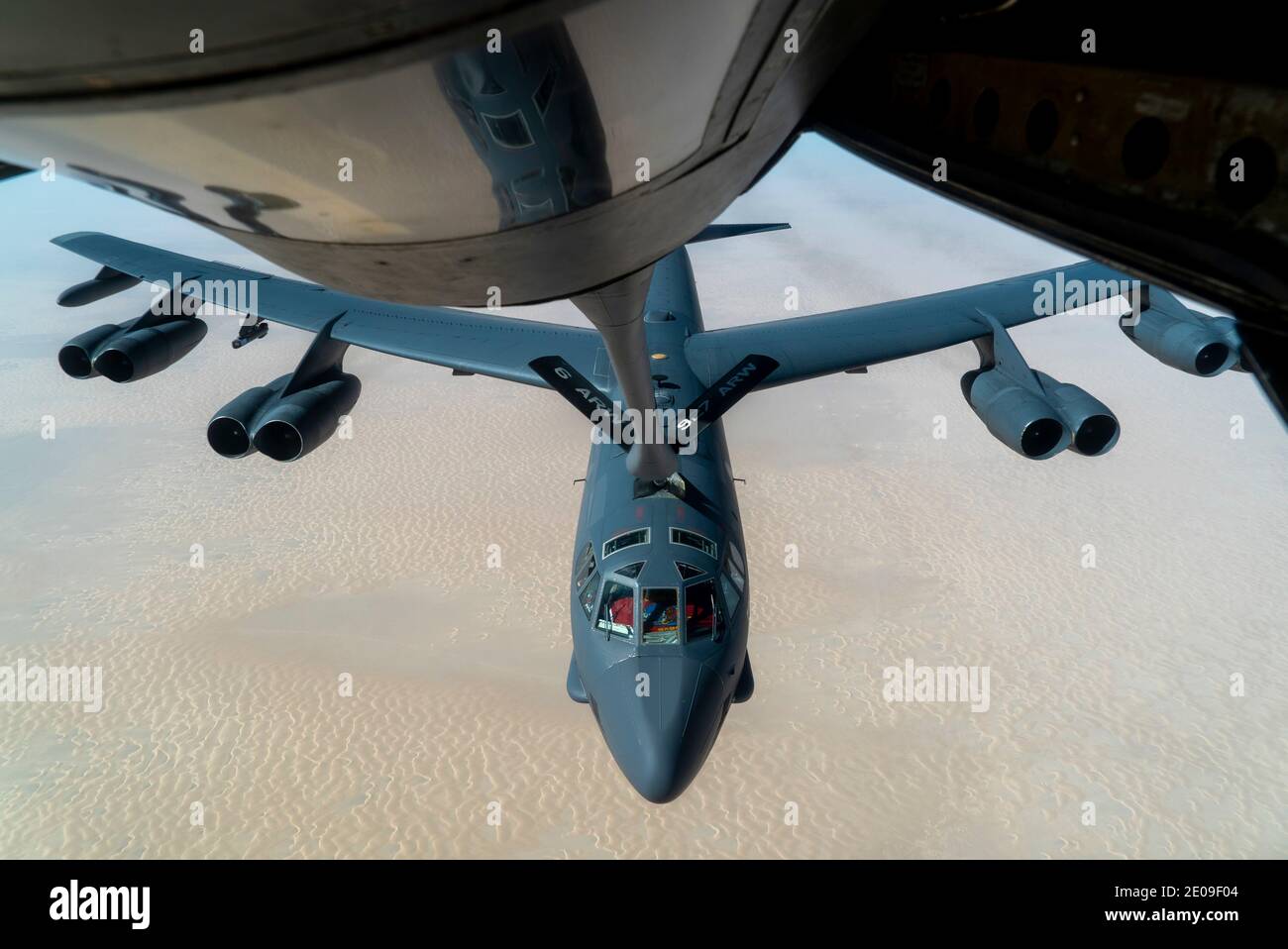 Persian Gulf, United States. 30th Dec, 2020. A U.S. Air Force B-52 Stratofortress strategic bomber aircraft from the 5th Bomb Wing, approaches a KC-135 Stratotanker for refueling December 30, 2020 over the Persian Gulf. The bomber is the third such show of force mission as a message to Iran. Credit: Planetpix/Alamy Live News Stock Photo