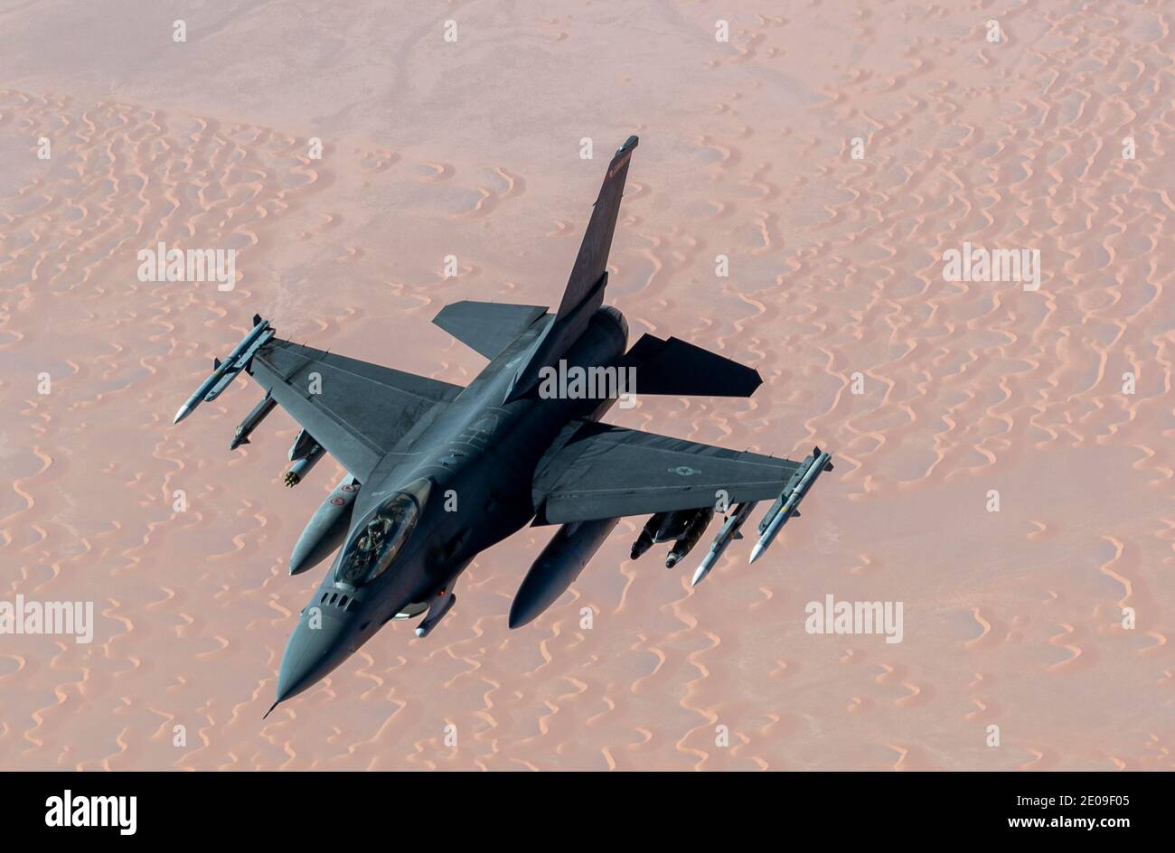 Persian Gulf, United States. 30th Dec, 2020. A U.S. Air Force A U.S. Air Force F-16 Fighting Falcon fighter jet approaches a KC-135 Stratotanker for refueling December 30, 2020 over the Persian Gulf. The fighter is an escort for B-52 Stratofortress strategic bombers during a show of force mission as a message to Iran. Credit: Planetpix/Alamy Live News Stock Photo