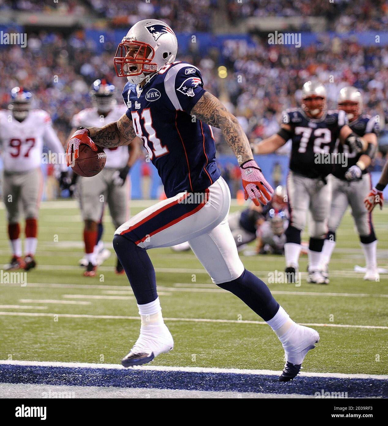 Tight end Aaron Hernandez (81) of the New England Patriots scores on the  opening drive of the second half in Super Bowl XLVI against the New York  Giants at Lucas Oil Stadium