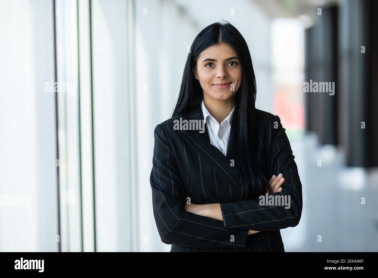 Portrait of young businesswoman in the office Stock Photo - Alamy