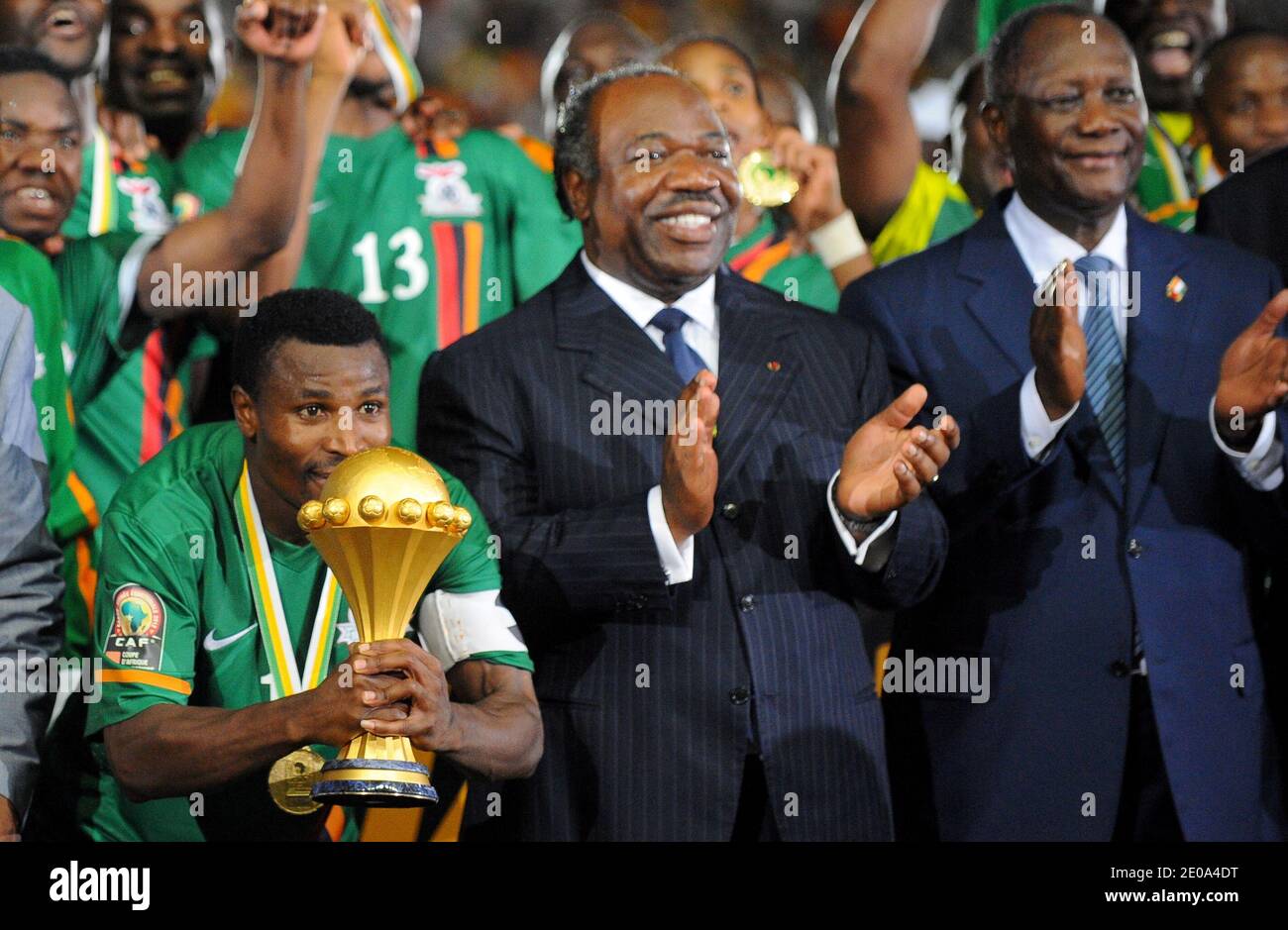 Zambia's national football team captain Christopher Katonga (Bottom L) receives the African Cup of Nations trophy from Gabon President Ali Bongo Ondima (R) and Guinea Equatorial President Theodoro Obiang Nguema (2nd R) during an awards ceremony at the end of the 2012 African Cup of Nations Soccer Match, Final, Zambia Vs Ivory Coast in Libreville, Gabon on February 12, 2012. Photo by ABACAPRESS.COM Stock Photo
