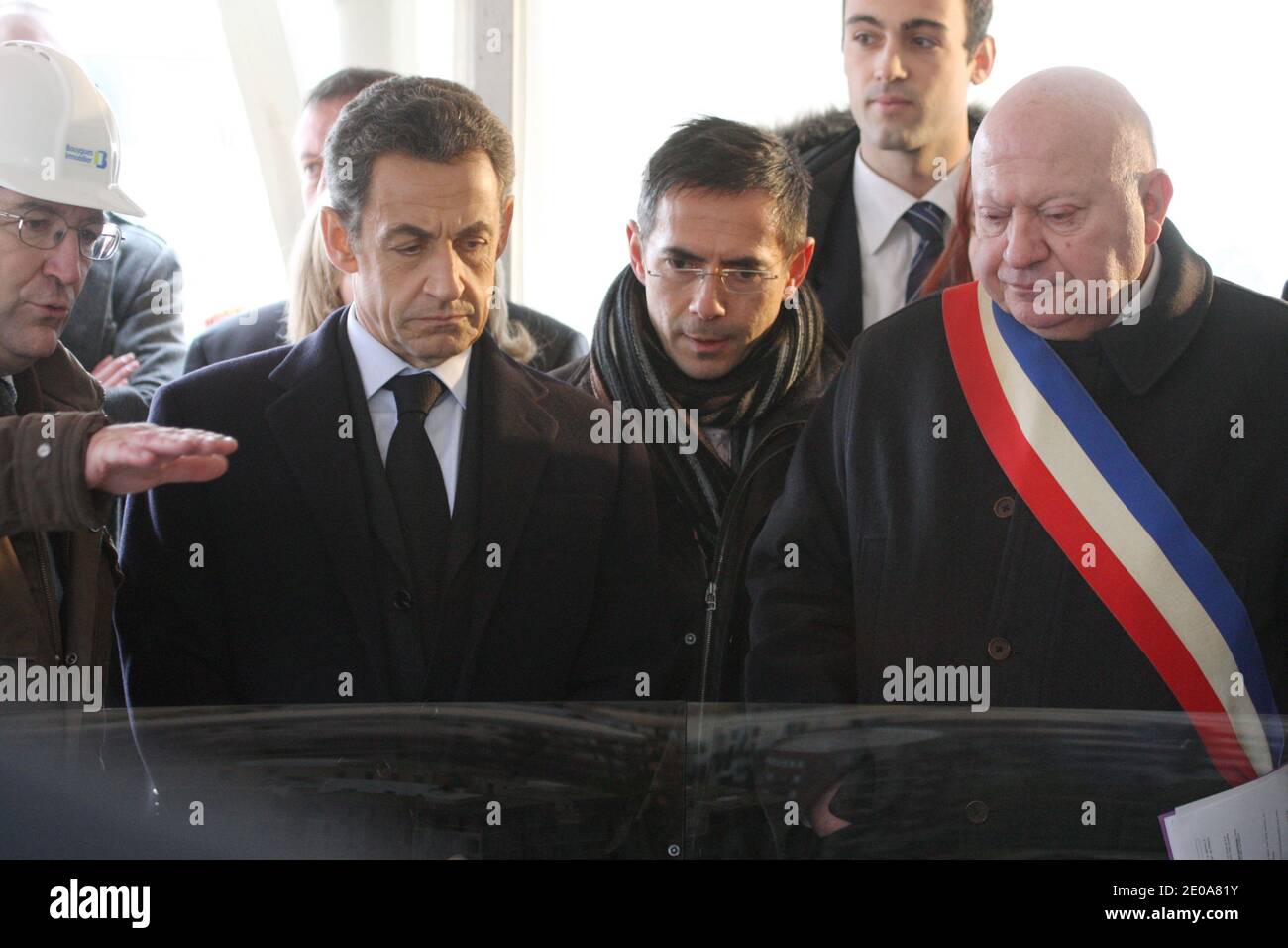 French President Nicolas Sarkozy, Issy-Les-Moulineaux Mayor Andre Santini look at the model of the next construction of 'Le Fort d'Issy' (an environmentally conscious neighbour) after inaugurates new headquarter of the national gendarmerie in Issy-Les-Moulineaux, near Paris, France on February 13, 2012. Photo by Ludovic/Pool/ABACAPRESS.COM Stock Photo