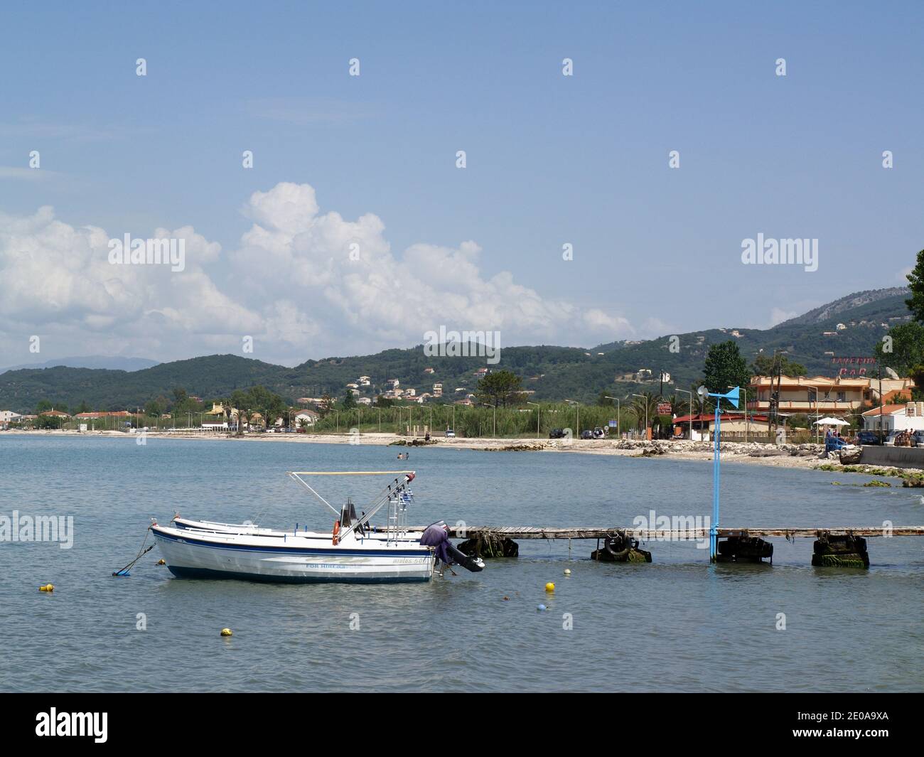 Boat, moored at wooden jetty taken from The Boathouse, Roda, Corfu ...