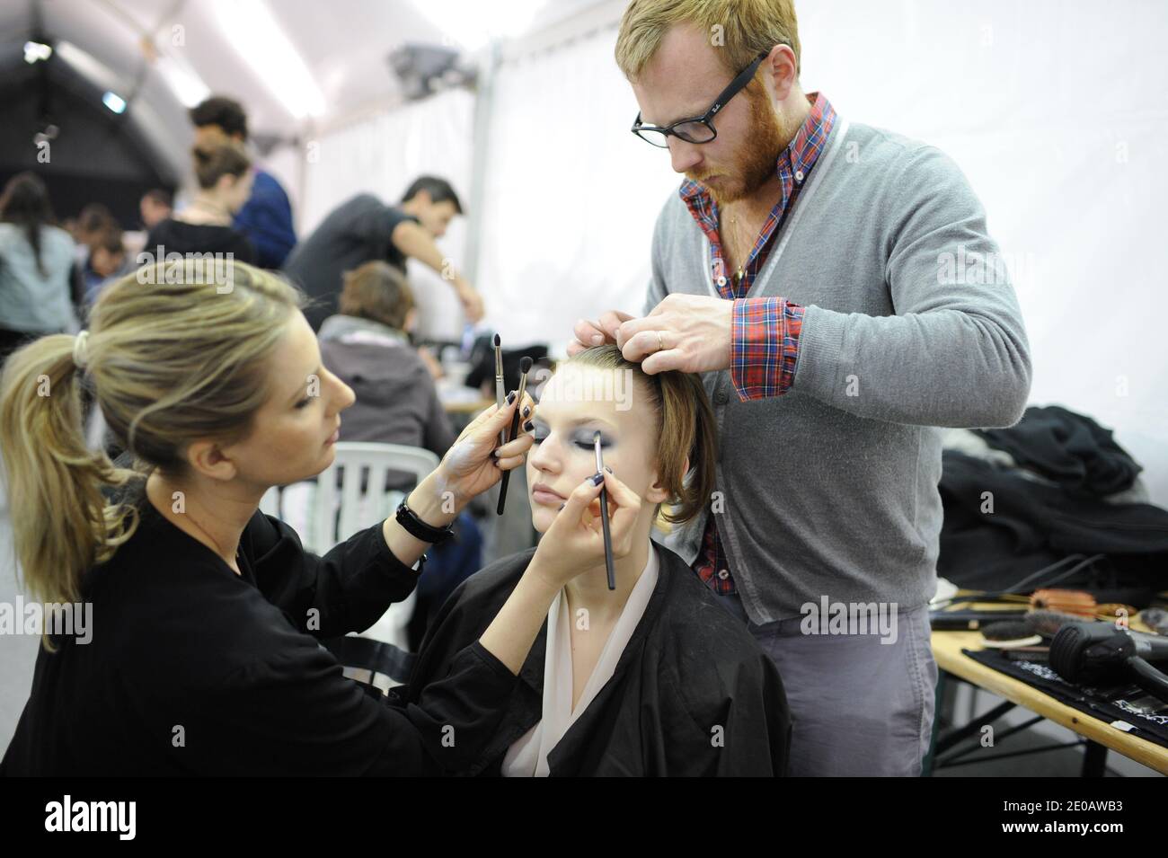 John Galliano Paris Ready to Wear Autumn Winter Twenties style make up,  finger waved hair and long quilted print coat Stock Photo - Alamy