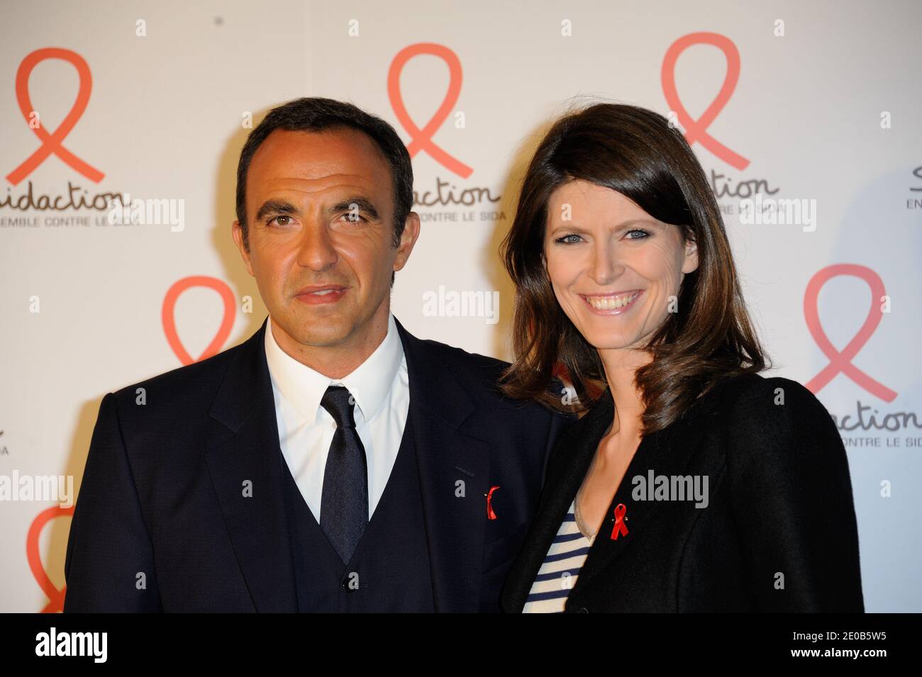 Nikos Aliagas and Magali Lunel posing at a photocall for the launch party of the 2012 Sidaction held at the Musee du quai Branly in Paris, France on March 12, 2012. Photo by Alban Wyters/ABACAPRESS.COM Stock Photo