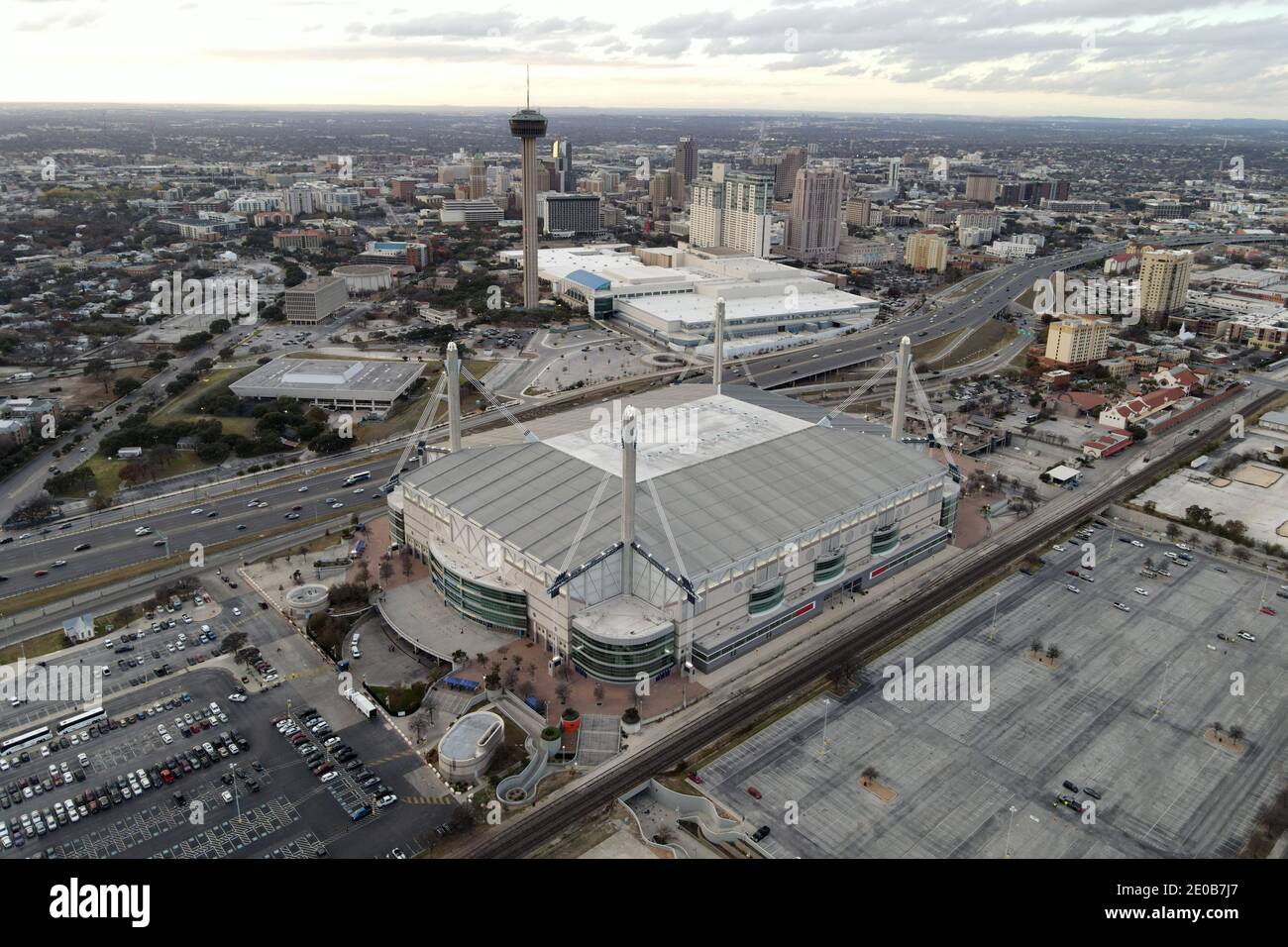 An aerial view of the Alamodome with the Tower of the Americas and downtown skyline as a backdrop, Tuesday, Dec. 29, 2020, in San Antonio, Tex. Stock Photo