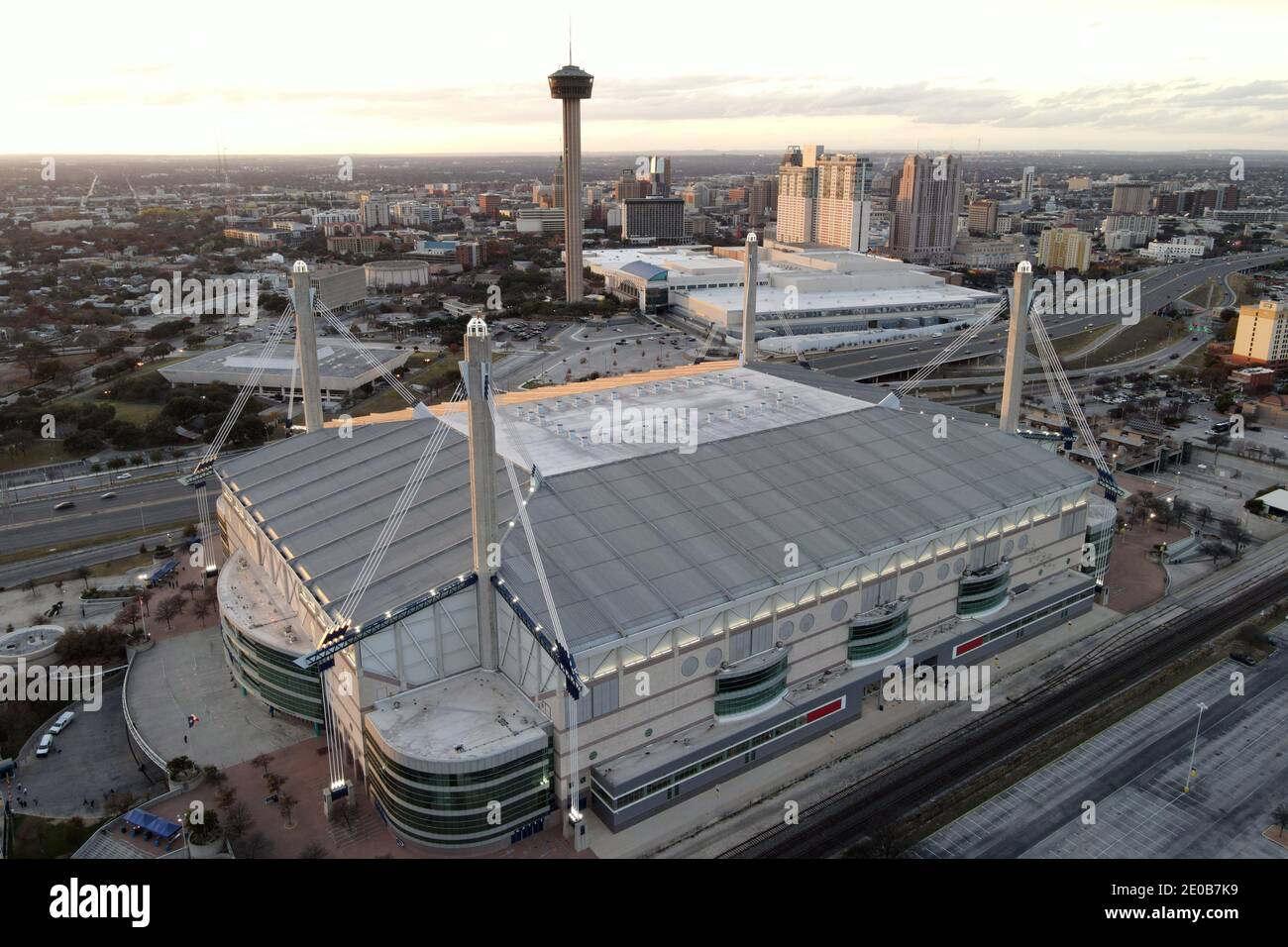 An aerial view of the Alamodome with the Tower of the Americas and downtown skyline as a backdrop, Tuesday, Dec. 29, 2020, in San Antonio, Tex. Stock Photo