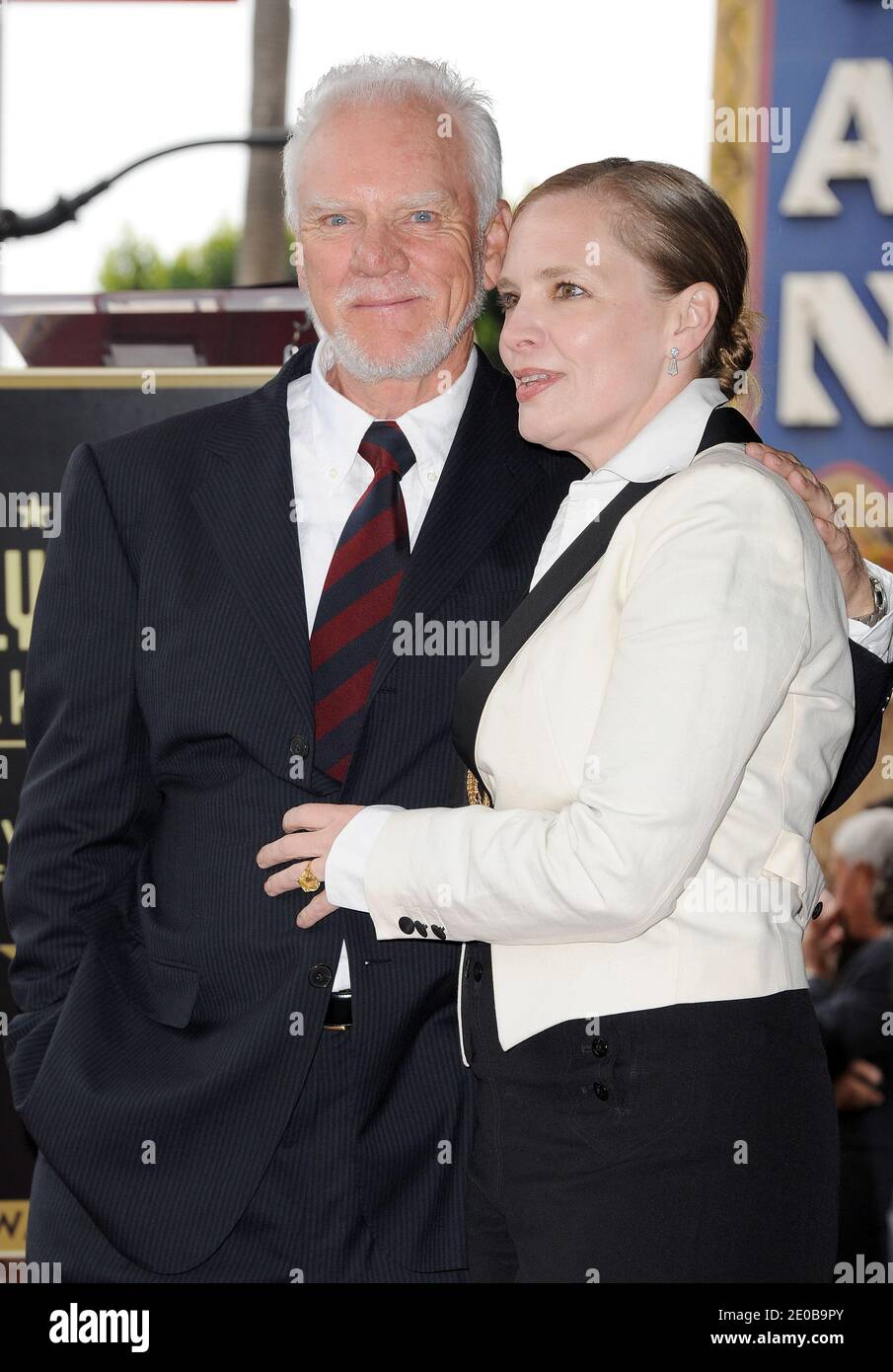 Malcolm McDowell posing with his wife Kelly is honored with a star on