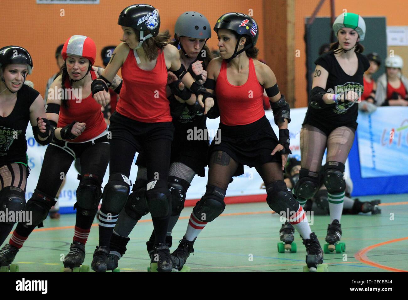 Paris Roller Girls (red) playing a match against Duchesses Nantes Roller Derby  Girls (green) during a national tournament in Nantes, western France on  March 17, 2012. Roller Derby is an American-invented contact
