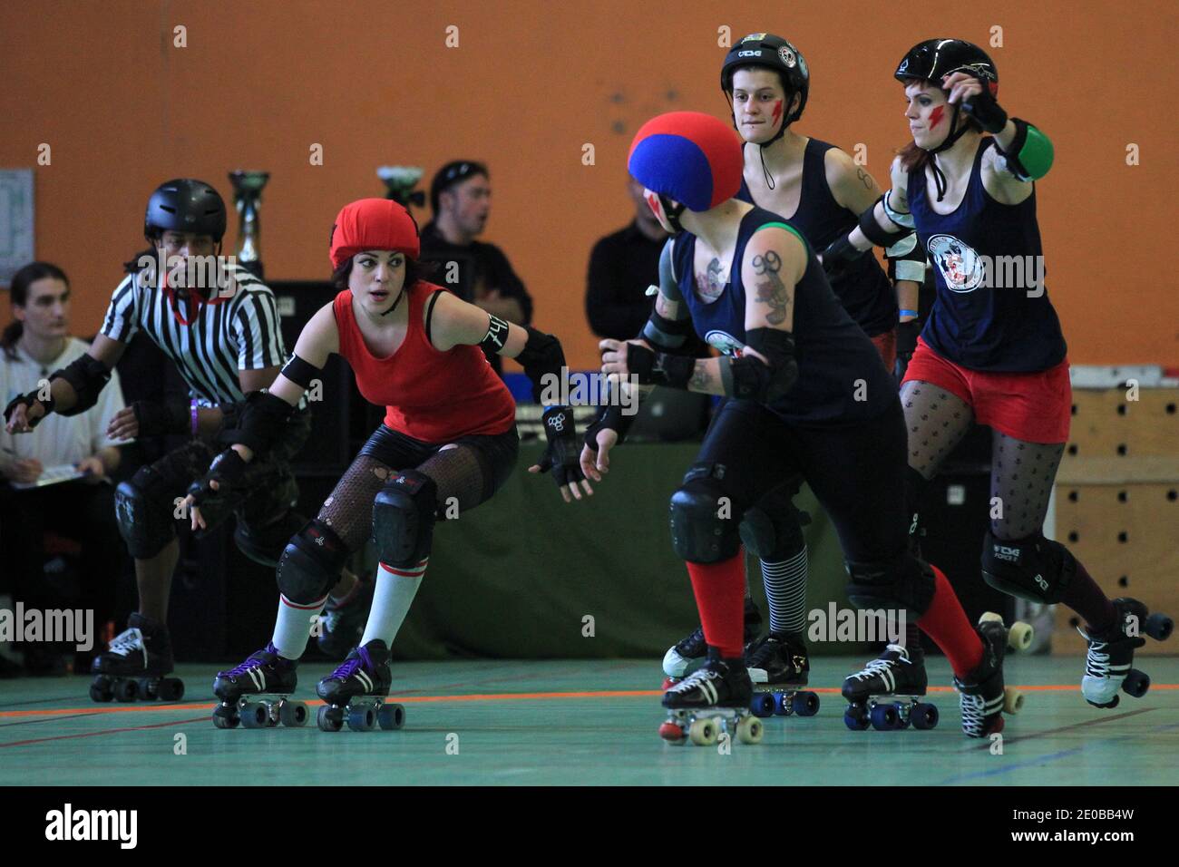 Metz Roller Girls (red) playing a match against Strasbourg Roller Derby  Girls (blue) during a national tournament in Nantes, western France on  March 17, 2012. Roller Derby is an American-invented contact sport.