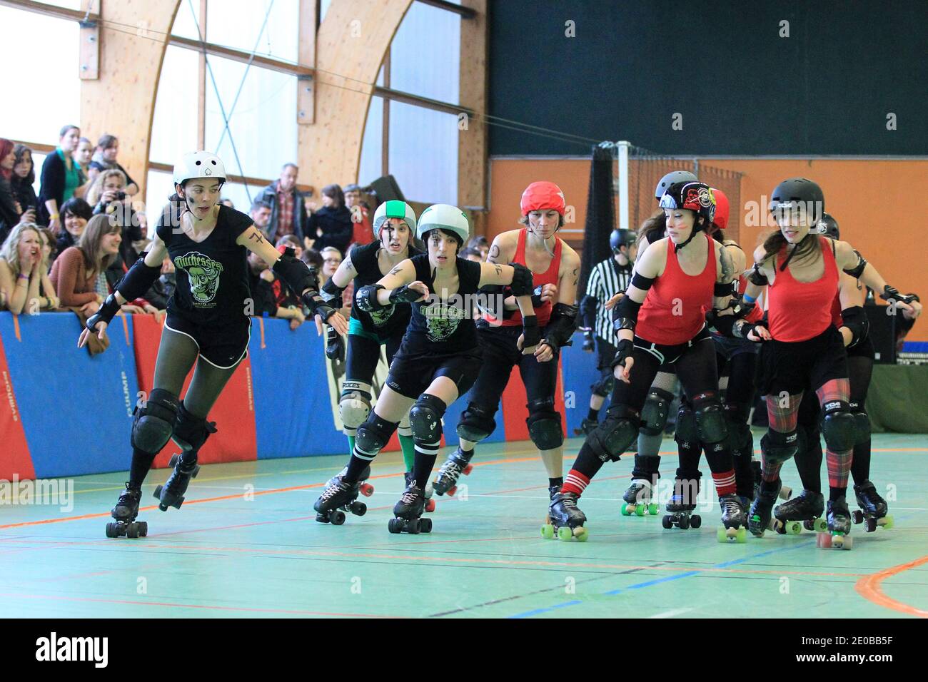 Paris Roller Girls (red) playing a match against Duchesses Nantes Roller Derby  Girls (green) during a national tournament in Nantes, western France on  March 17, 2012. Roller Derby is an American-invented contact