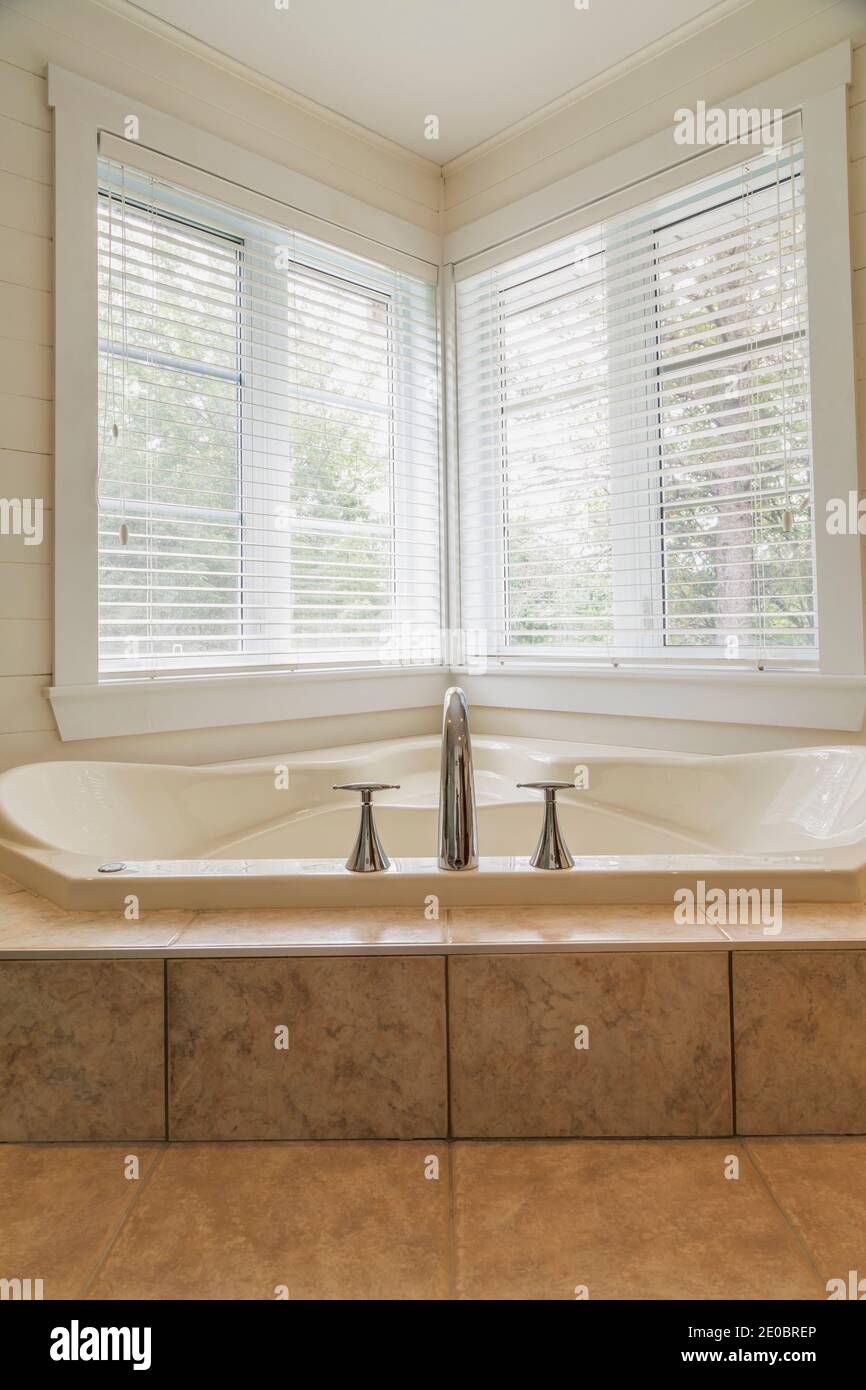 Modern bathroom with jacuzzi bath, copy space Stock Photo - Alamy