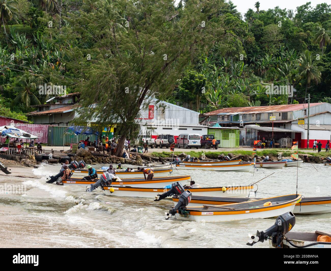 Passenger ferries waiting for passengers in Wewak, the capital of the East Sepik province of Papua New Guinea. These dinghies are used for public tran Stock Photo