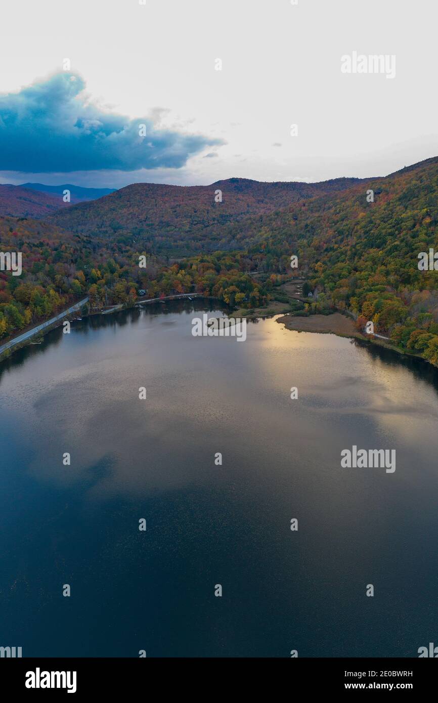 Aerial view of Amherst Lake in fall foliage in Plymouth, Vermont Stock