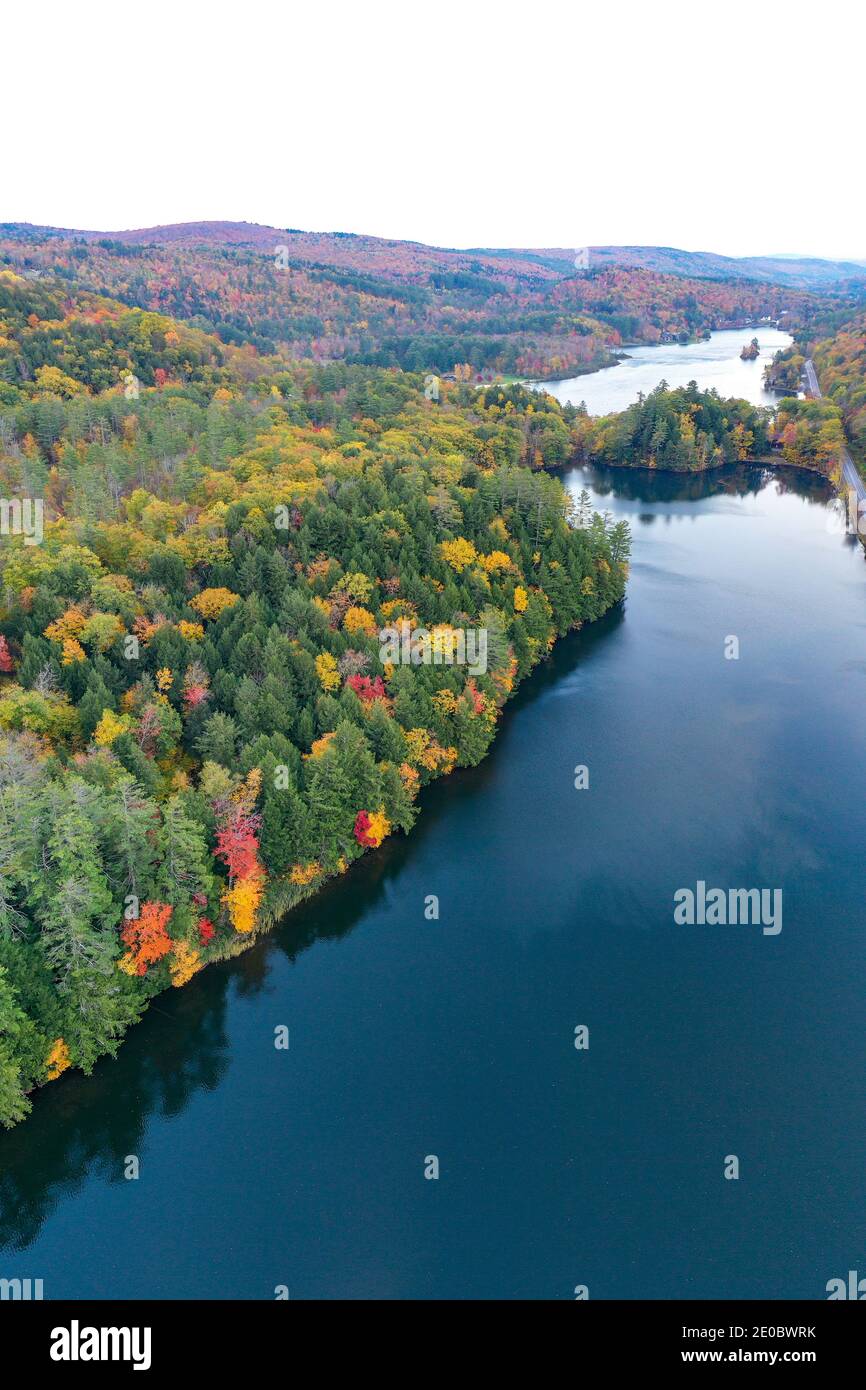 Aerial view of Amherst Lake in fall foliage in Plymouth, Vermont Stock