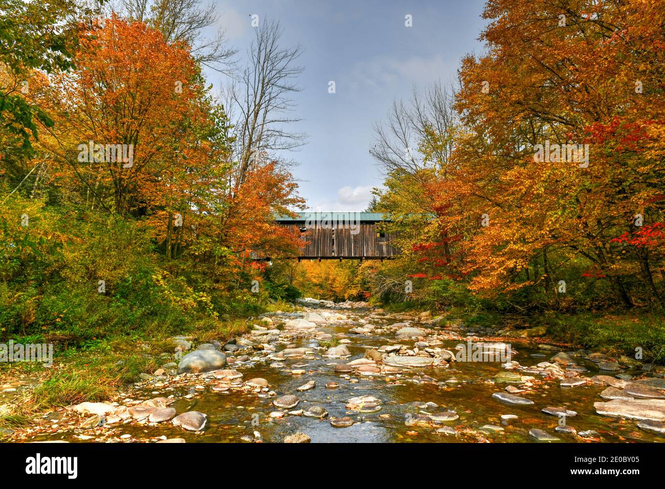 Grist Mill Covered Bridge in Cambridge, Vermont during fall foliage. Stock Photo