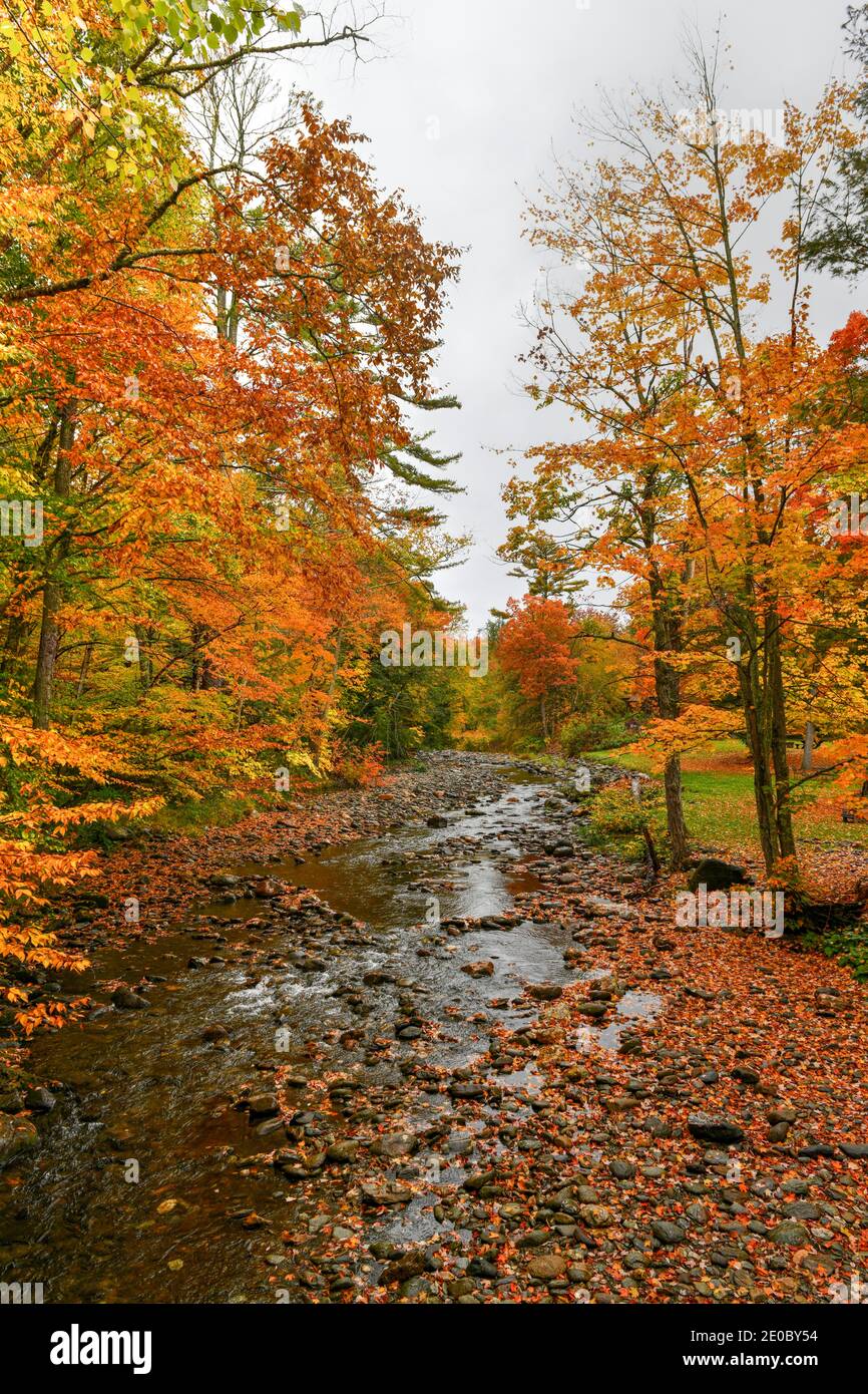 View from the Brookdale Covered Bridge in Stowe, Vermont during fall foliage over the West