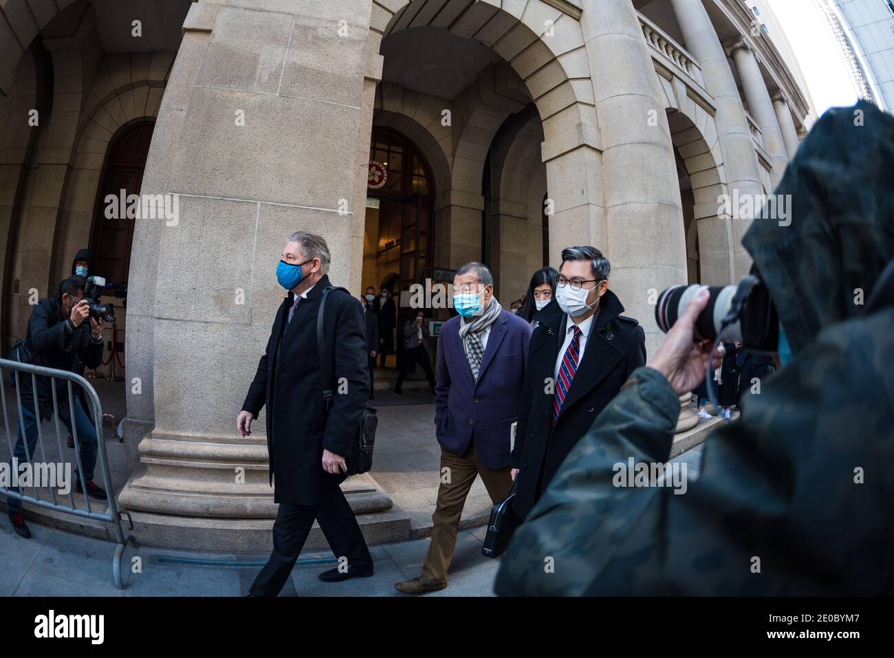 Hong Kong, China. 31st Dec, 2020. Media Mogul Jimmy Lai exits the Court of Final Appeal accompanied by his lawyers after an urgent hearing requested by the Department of Justice on his bail conditions. Jimmy Lai was charged with National Security Law breaches and was granted bail before Christmas. His bail was revoked by the Court at 4 pm on 31st December 2020. Credit: Marc R. Fernandes/Alamy Live News Stock Photo