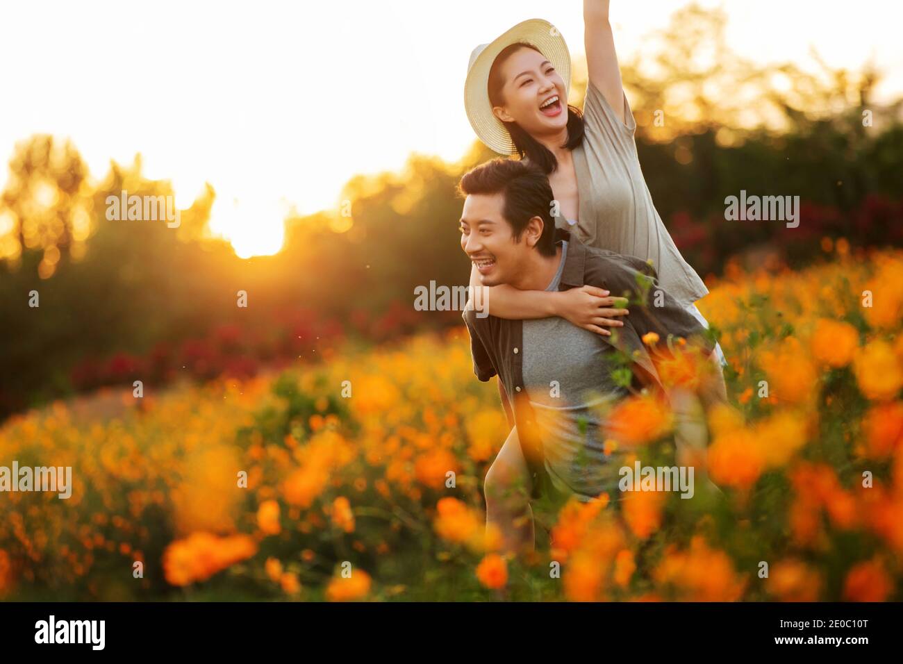 The flowers in the happy young couple Stock Photo - Alamy